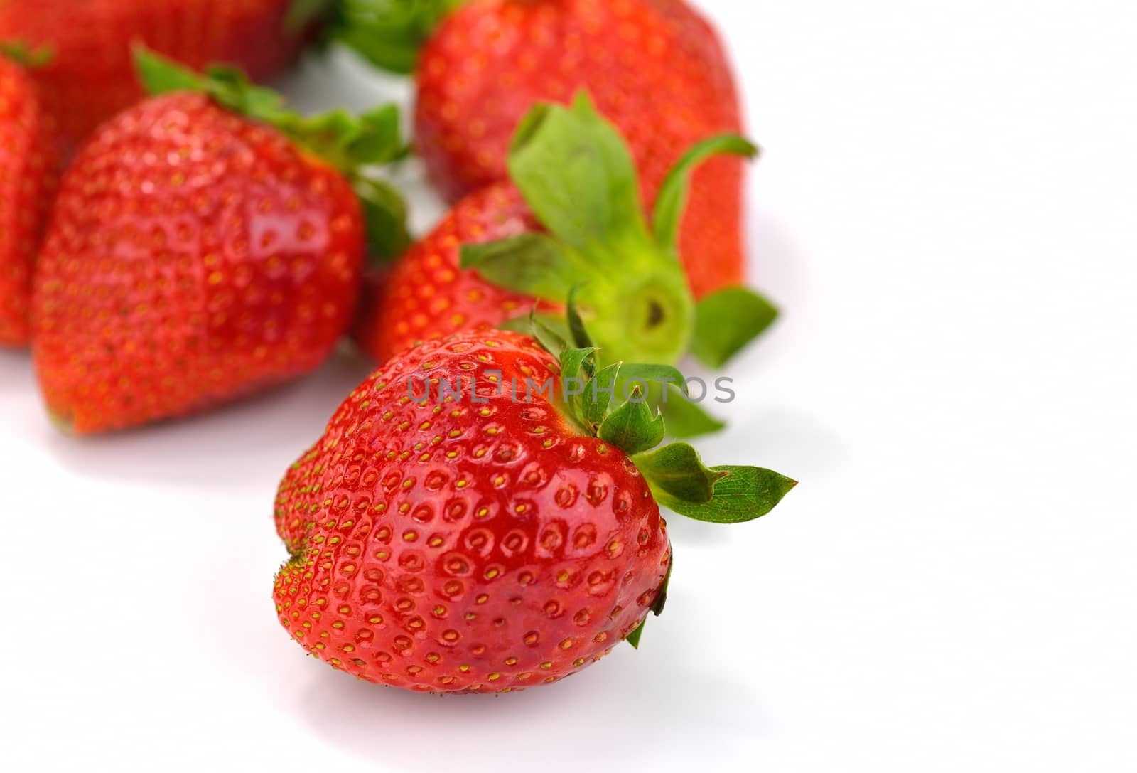 Isolated strawberries over white background