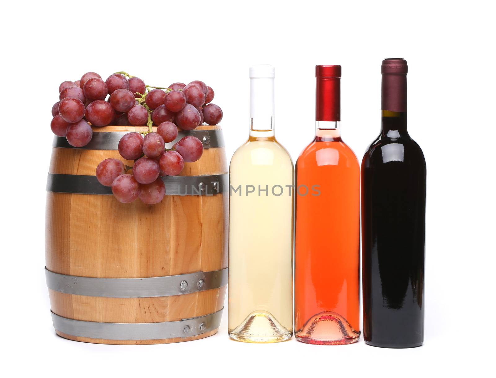 barrel and bottles of wine and ripe grapes on wooden by indigolotos