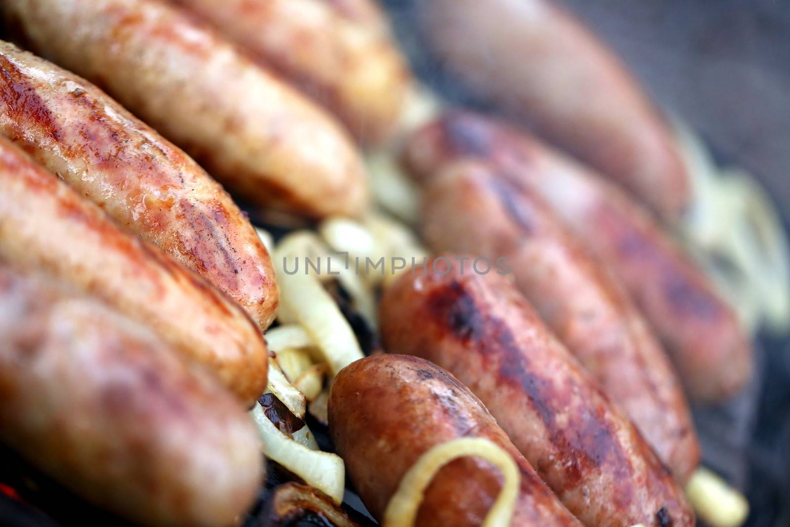 Bratwurst sausages on grill.