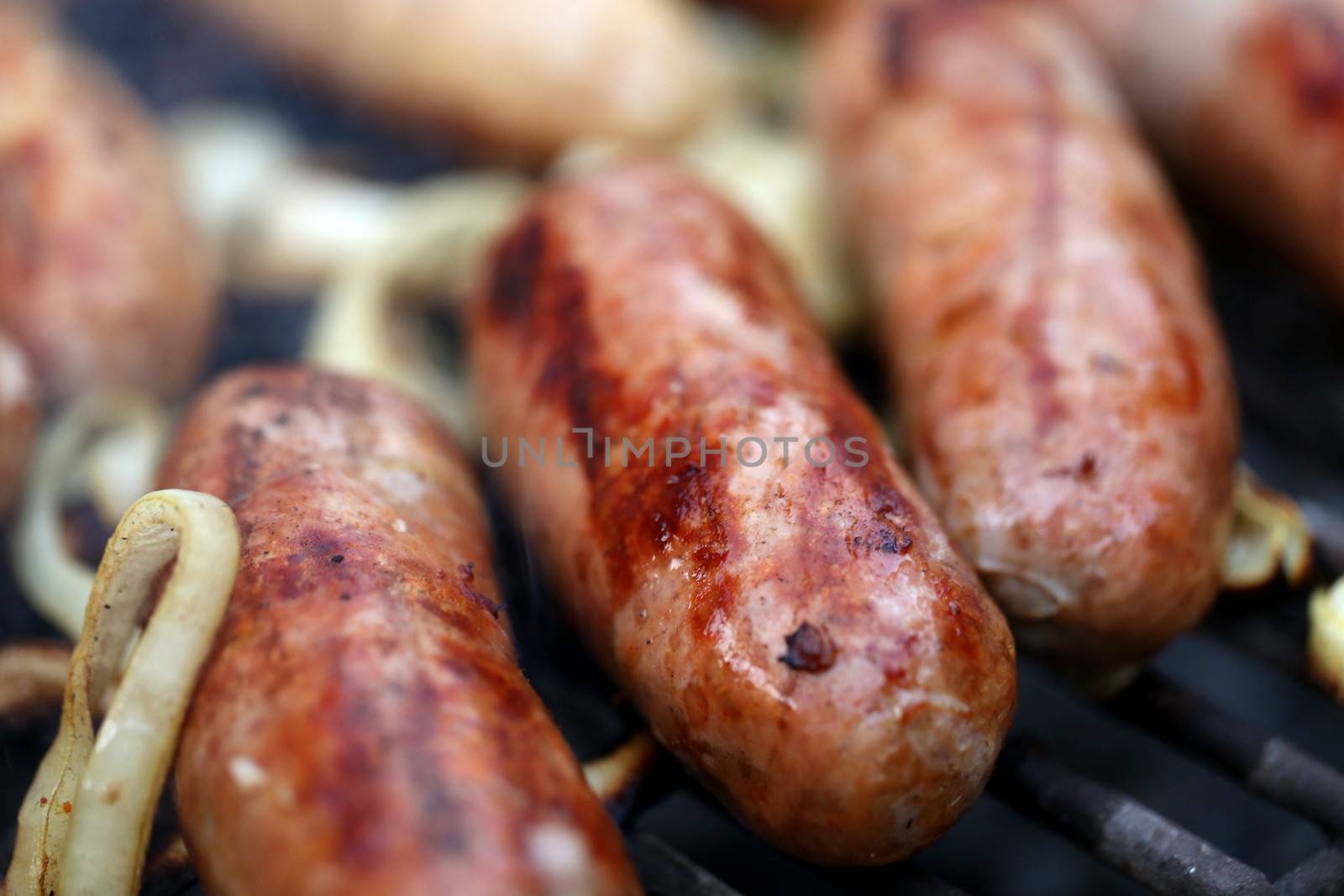 grilled sausages close up, barbecue by indigolotos