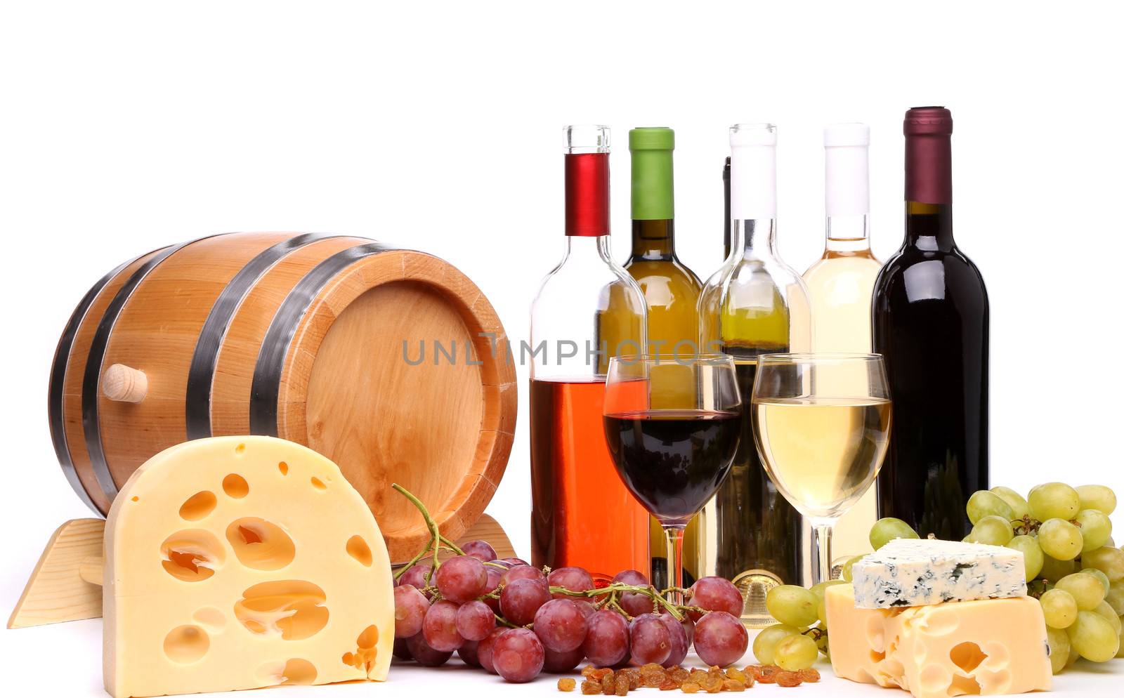 barrel, cheeses, bottles and glasses of wine and ripe grapes on wooden