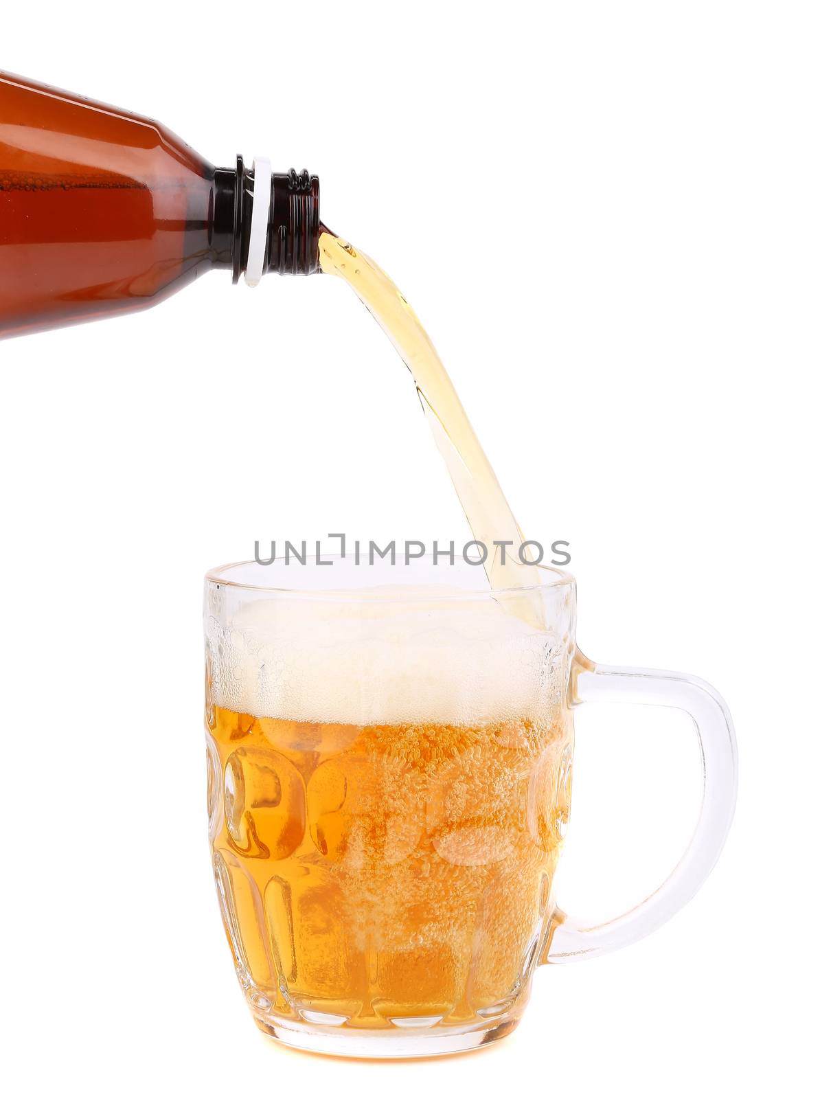 Close up of bottle of beer pouring into a mug. by indigolotos