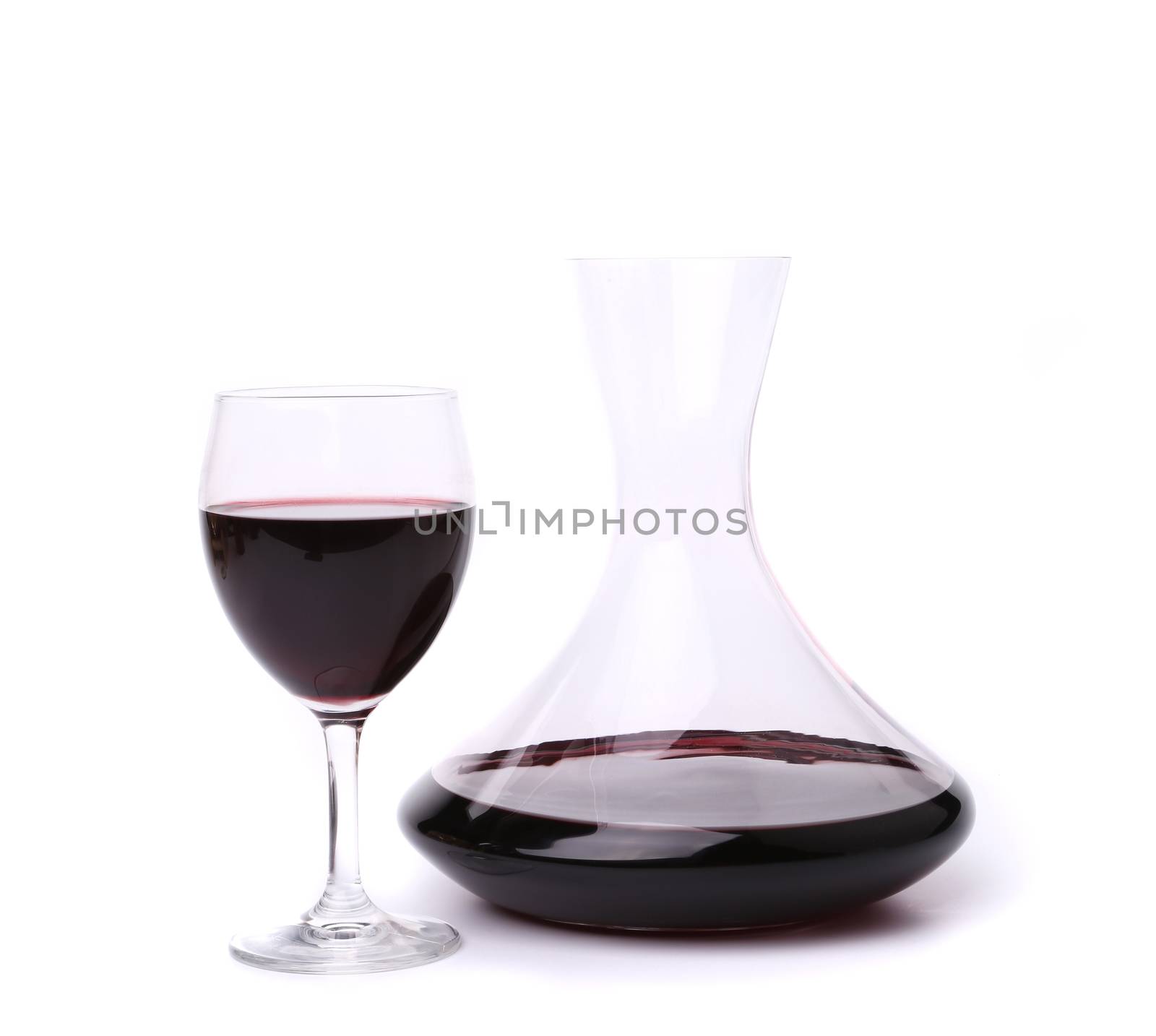 decanter with red wine and glass by indigolotos