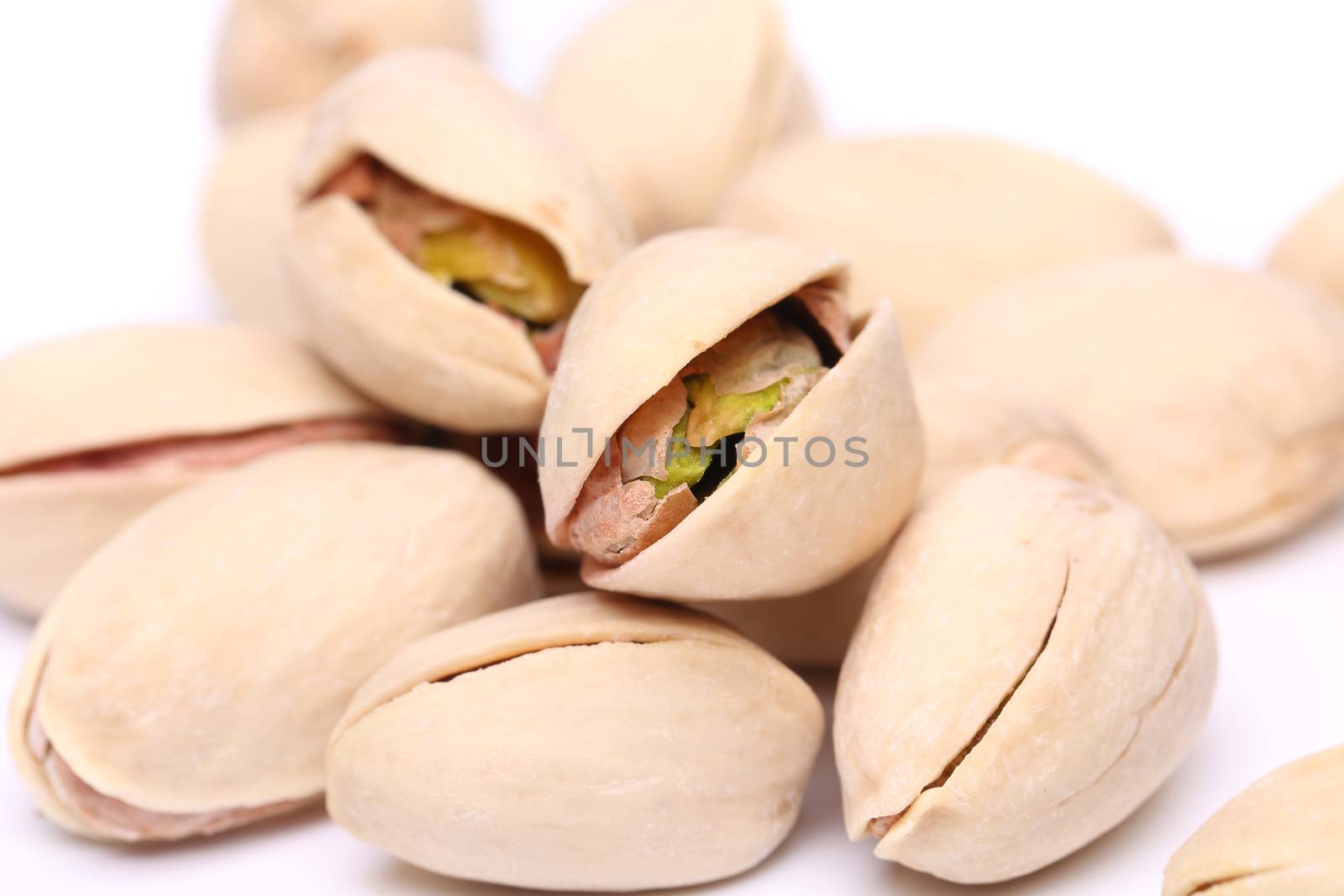 Large handful of pistachios by indigolotos