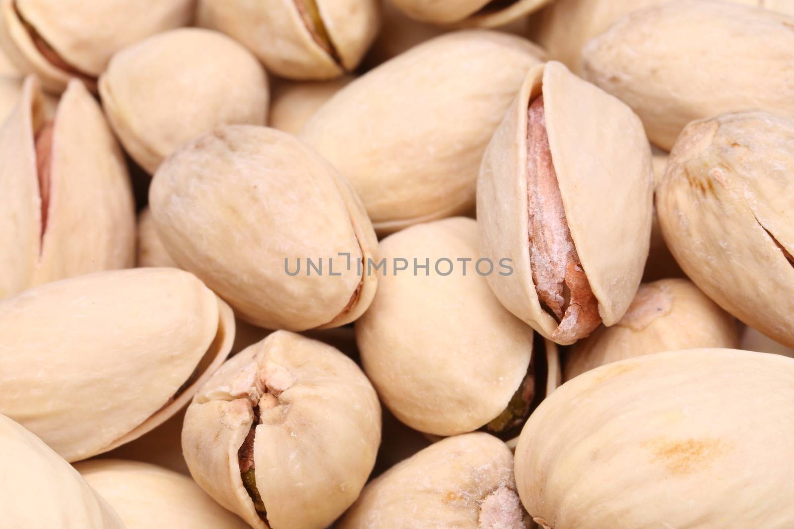 Background of pistachios by indigolotos