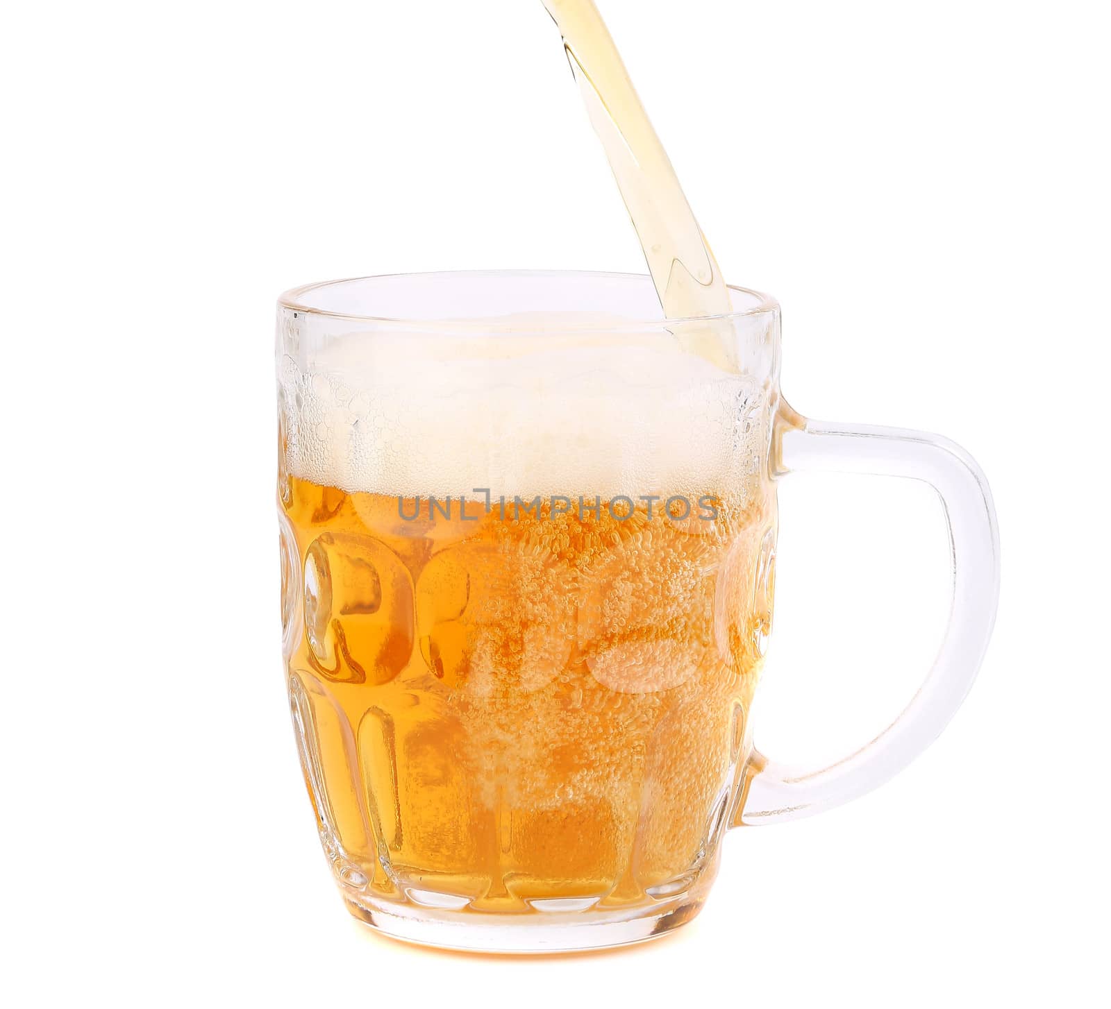 Beer pouring into beer mug by indigolotos