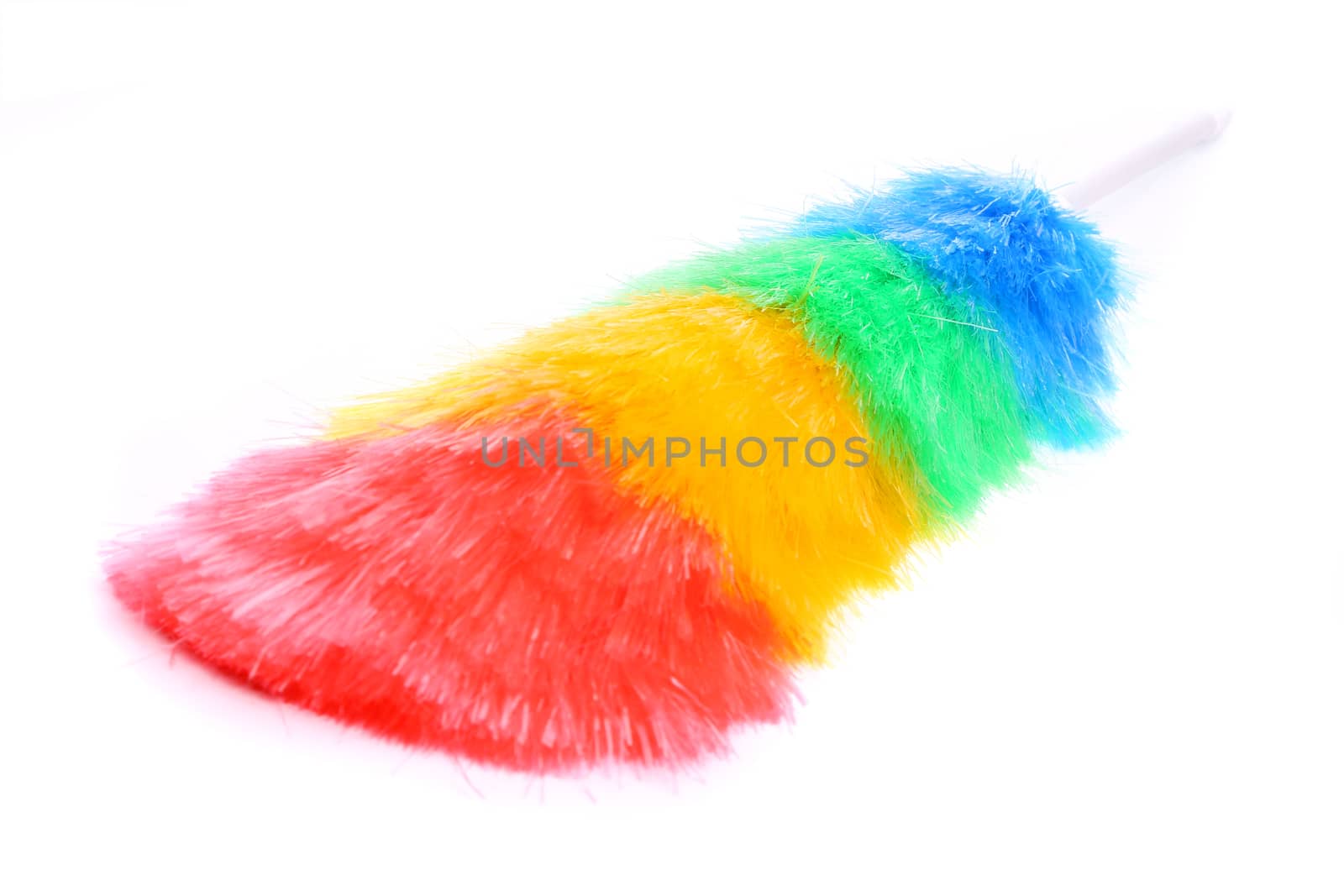 Soft colorful duster with plastic handle close-up by indigolotos
