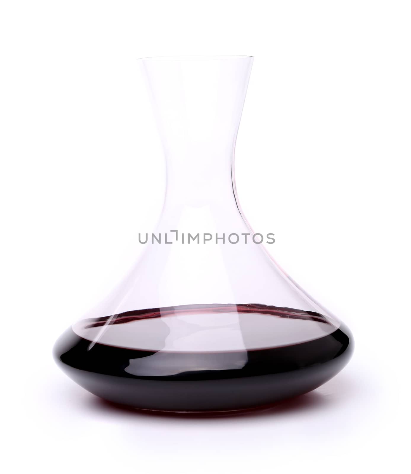 A decanter of red wine isolated over white background by indigolotos