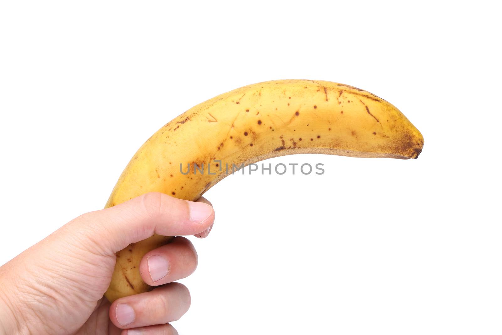 A stale banana in a hand