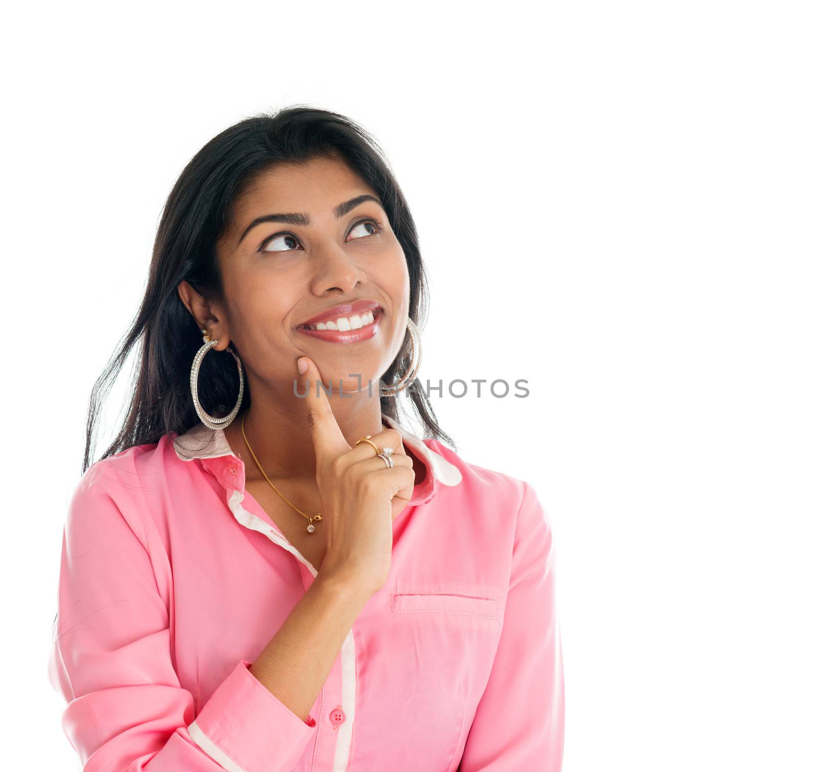 Indian woman thinking. India businesswoman having a thought, finger on chin looking up smiling happy. Portrait of beautiful Asian female model standing isolated on white background.