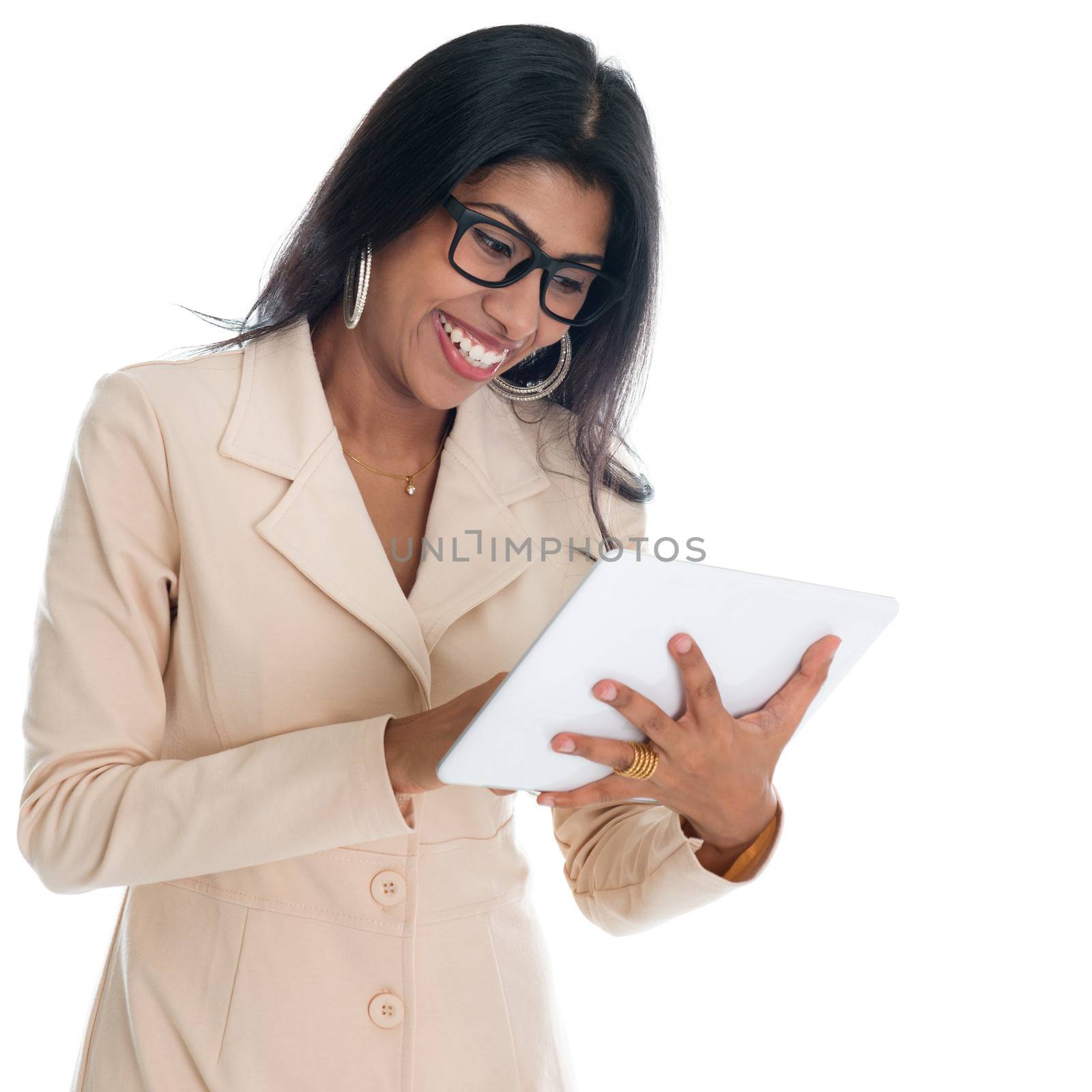Indian businesswoman working with digital tablet pc. India office woman using digital tablet pc. Portrait of beautiful Asian female model isolated on white background.