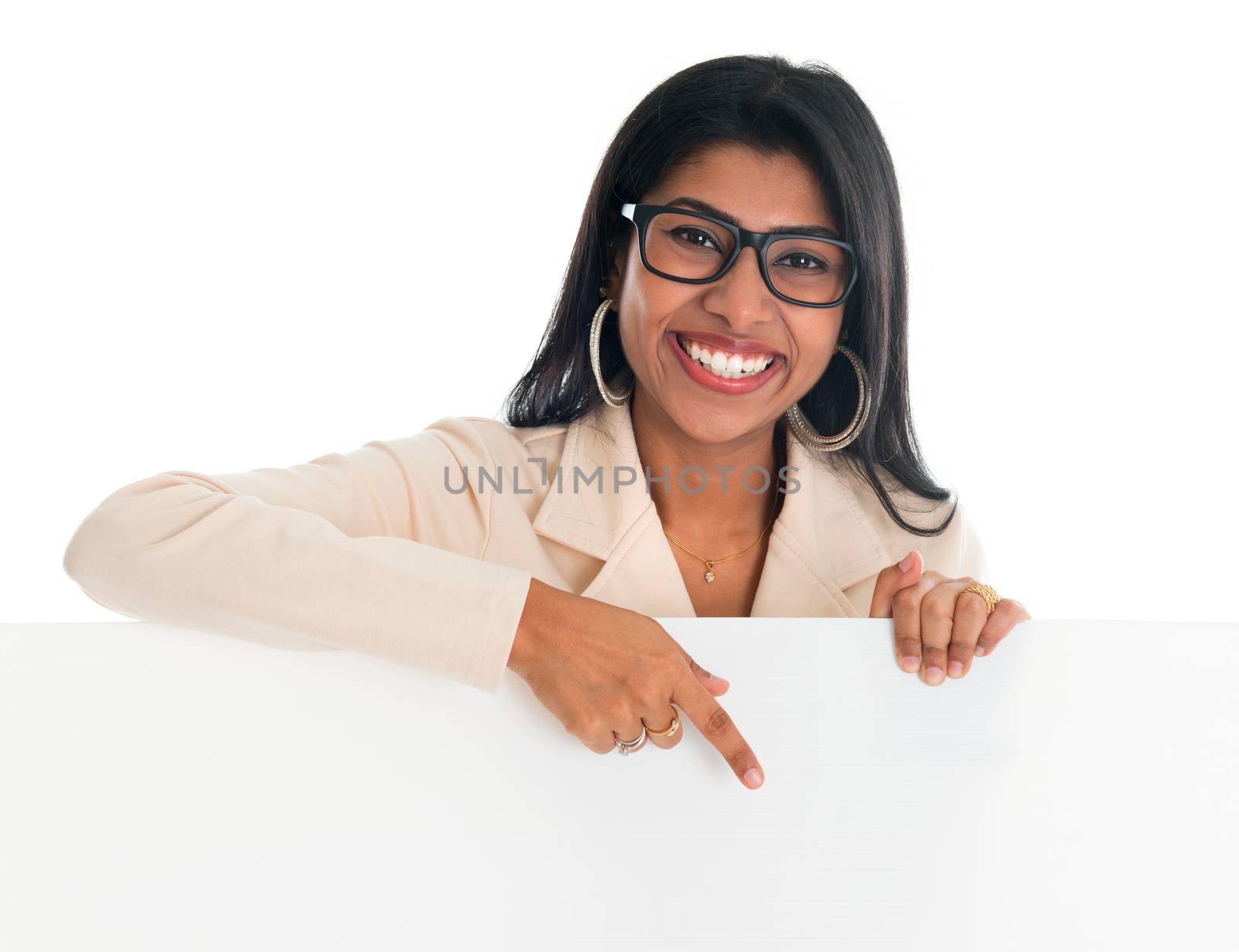 Indian woman holding and pointing to blank billboard. Portrait of attractive young Asian female model isolated on white background.