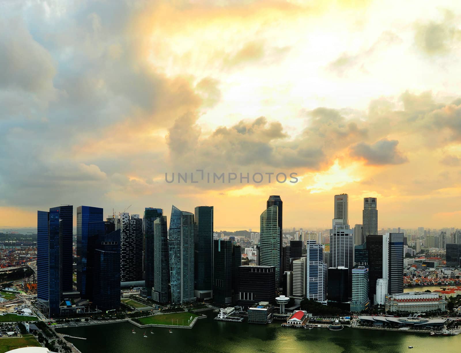 Aerial view of Singapore downtown with moody sunset sky