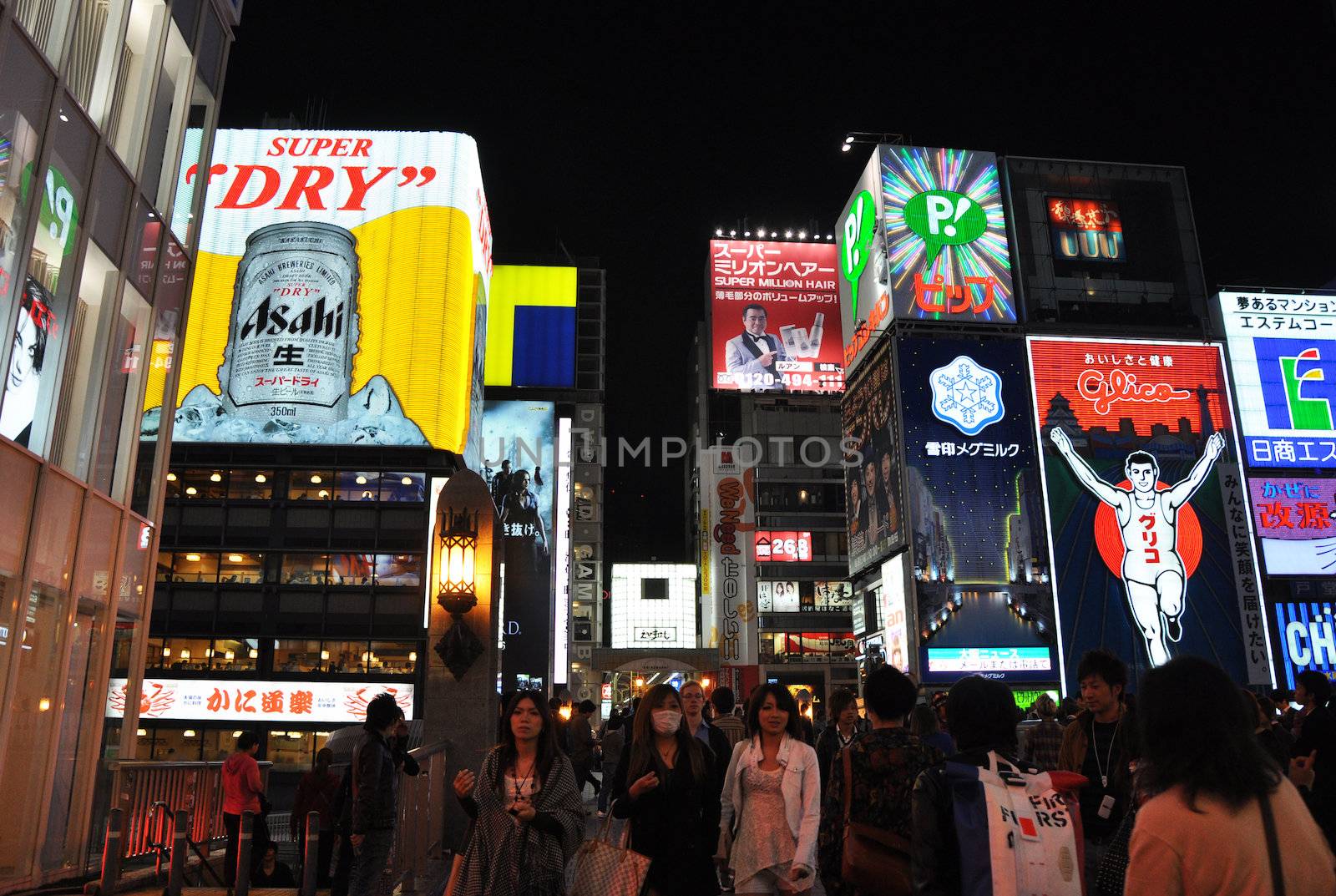 OSAKA, JAPAN - OCT 23: People visit famous Dotonbori street on October 23, 2012 in Osaka, Japan. According to Tripadvisor Dotonbori is the 3rd best attraction to visit in Osaka. 