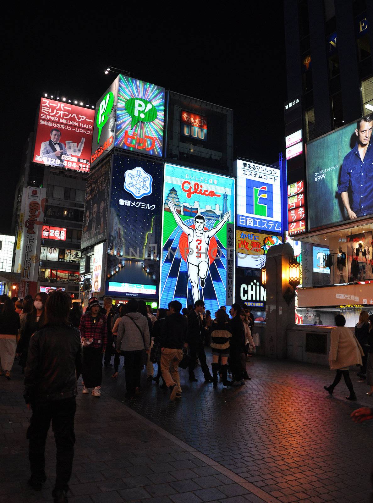 OSAKA, JAPAN - OCT 23: The Glico Man Running billboard and other by siraanamwong