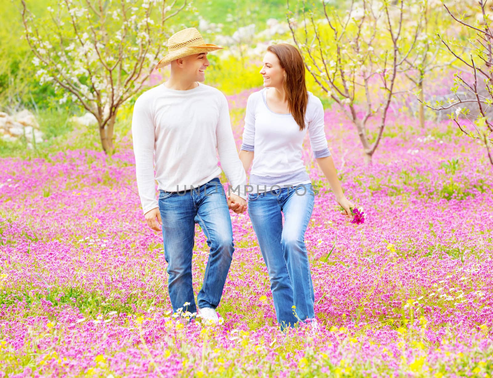 Happy lovers walking outdoors by Anna_Omelchenko