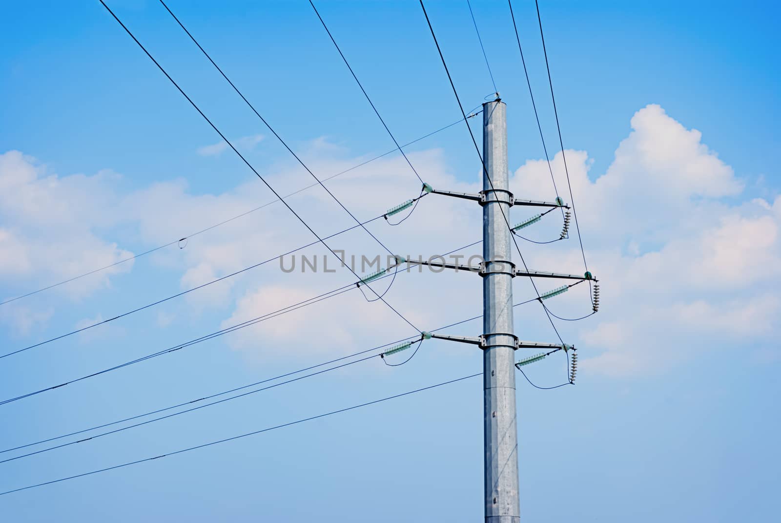 electric wires pole on a background of blue sky by Zhukow