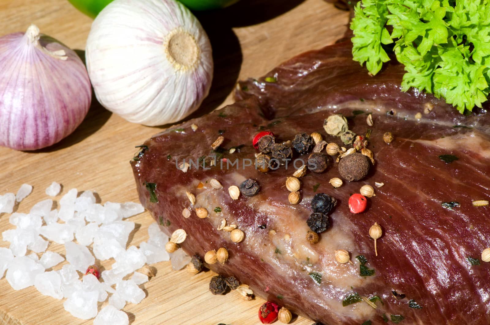 meat with fresh vegetables on wooden board