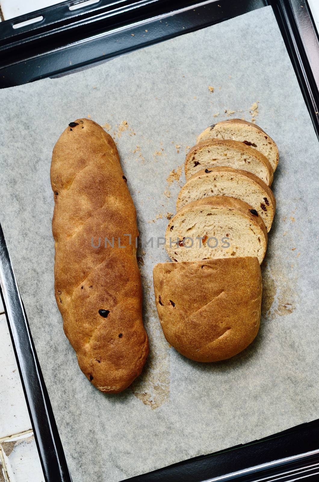 Homemade raisin bread in tray