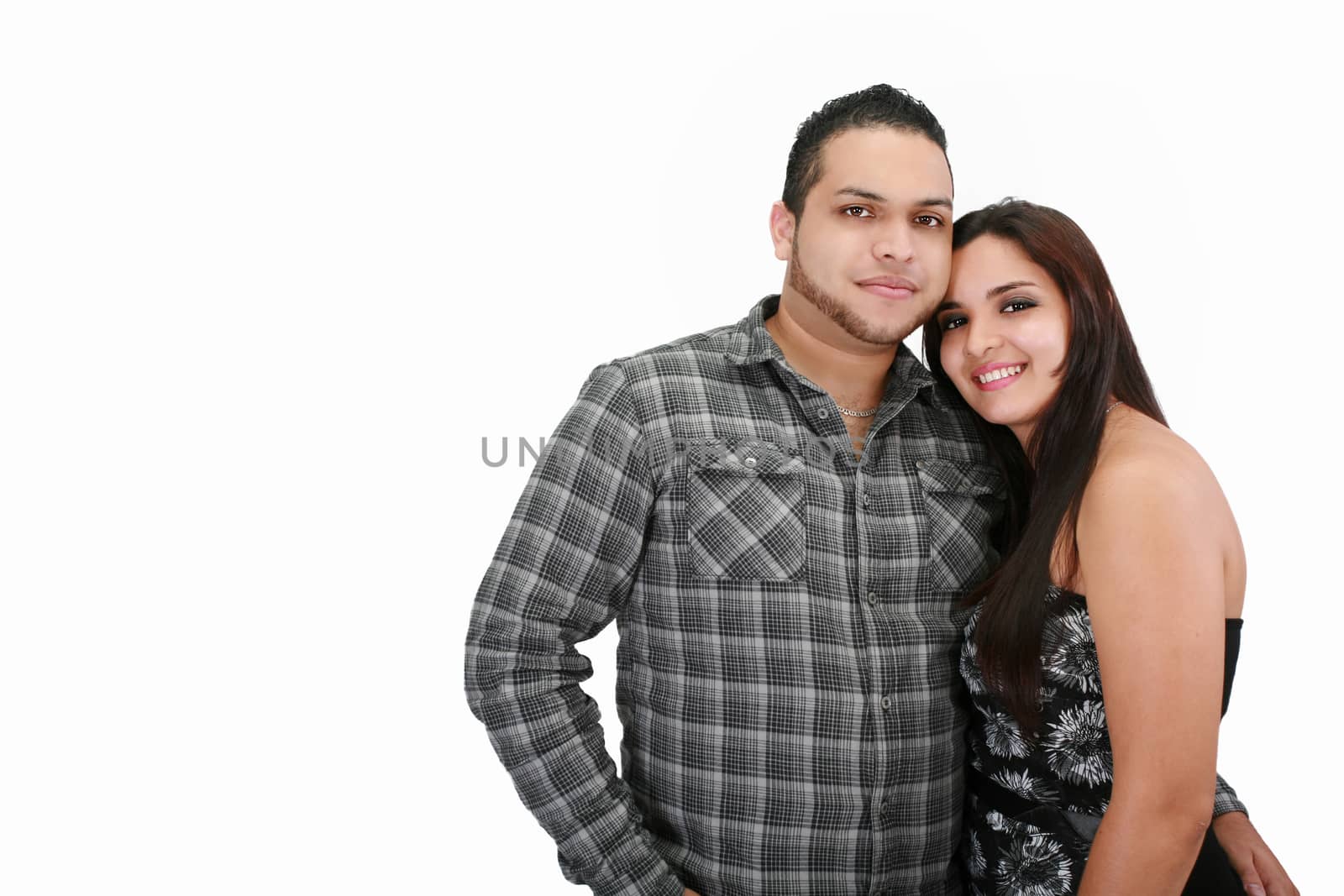 Hispanic couple smiling by dacasdo