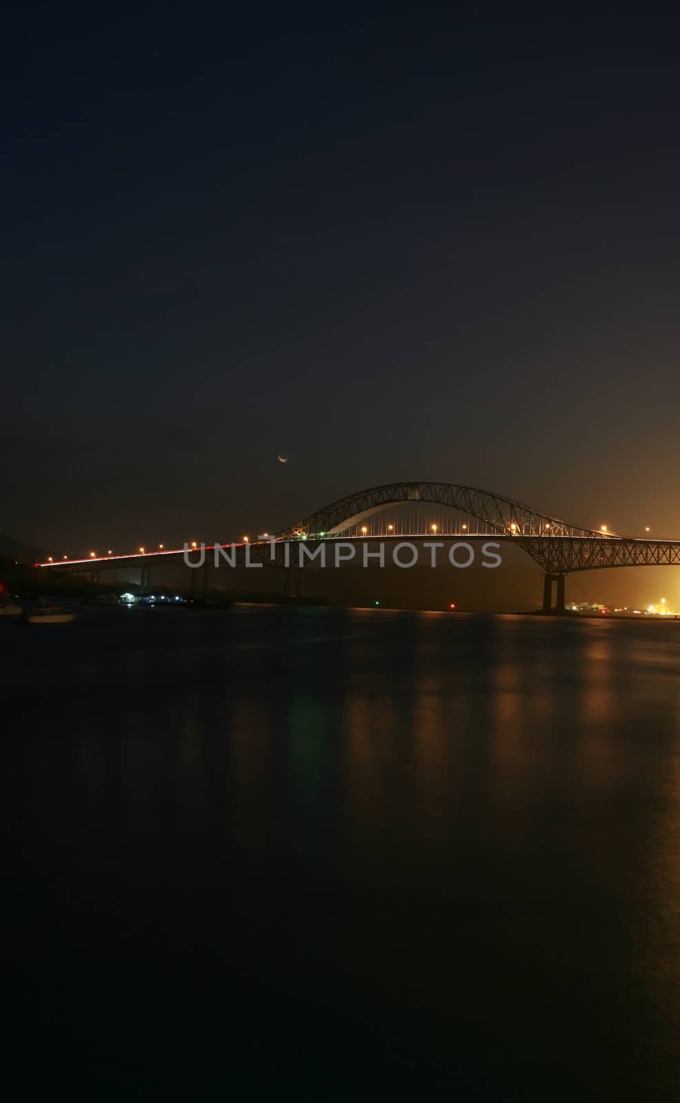 The TransAmerica Bridge in Panama City at night by dacasdo