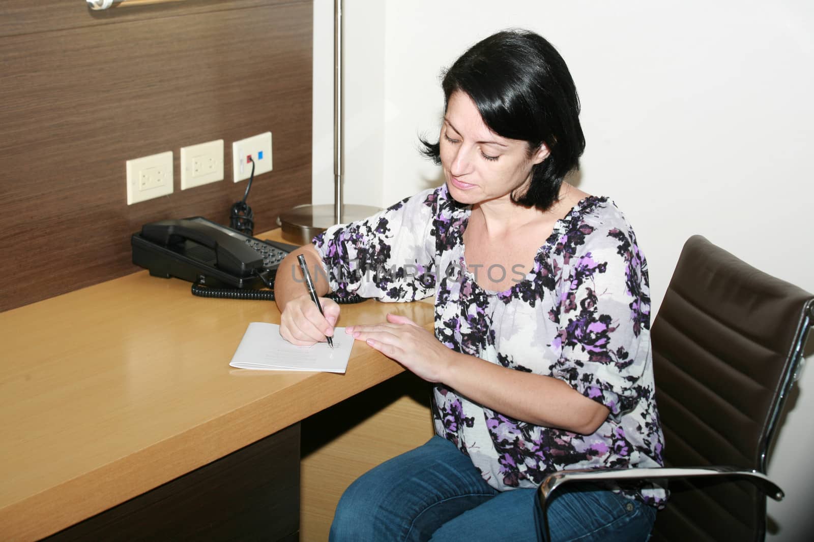 Businesswoman taking notes