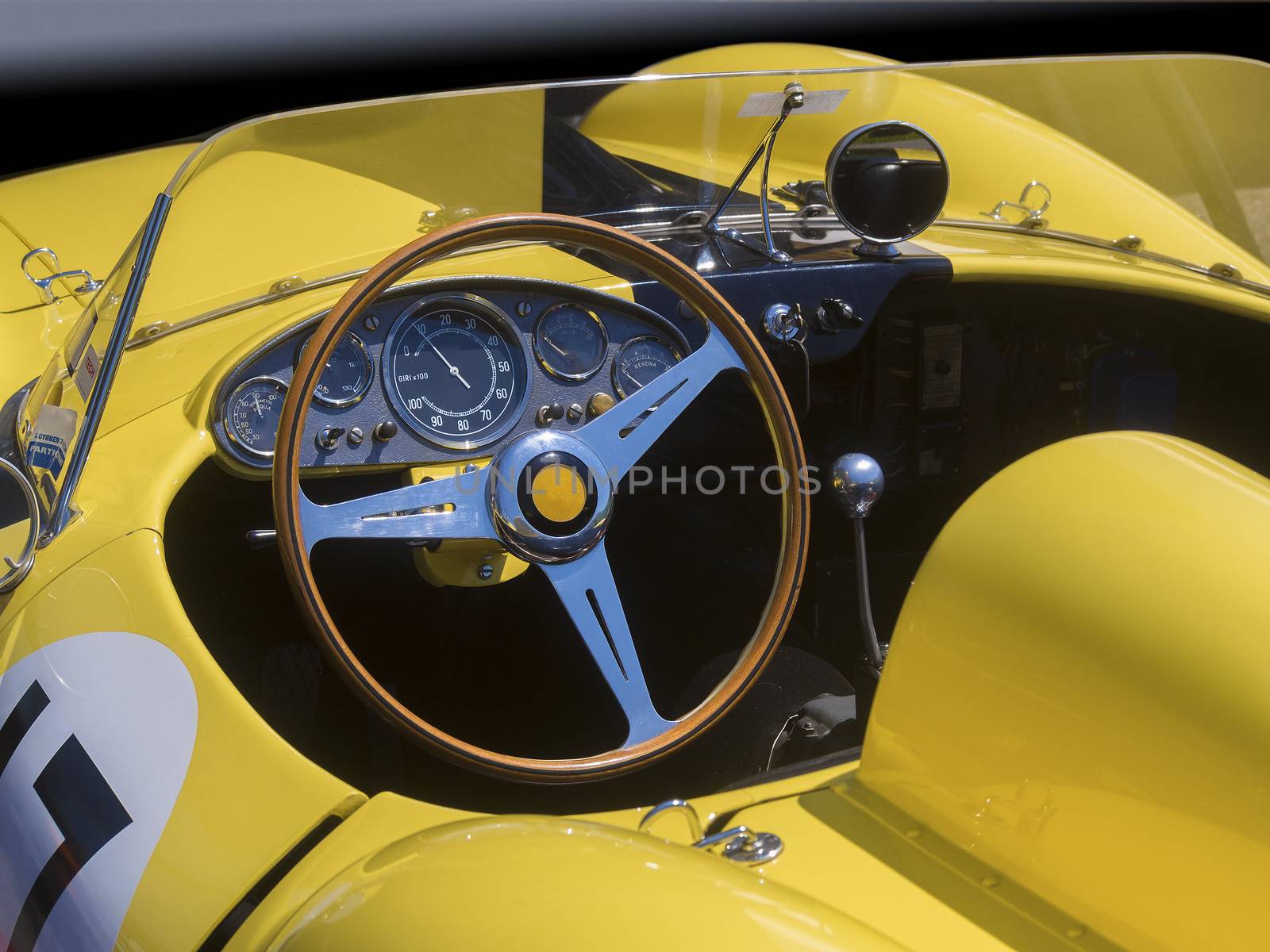 Race car dashboard and cockpit in yellow
