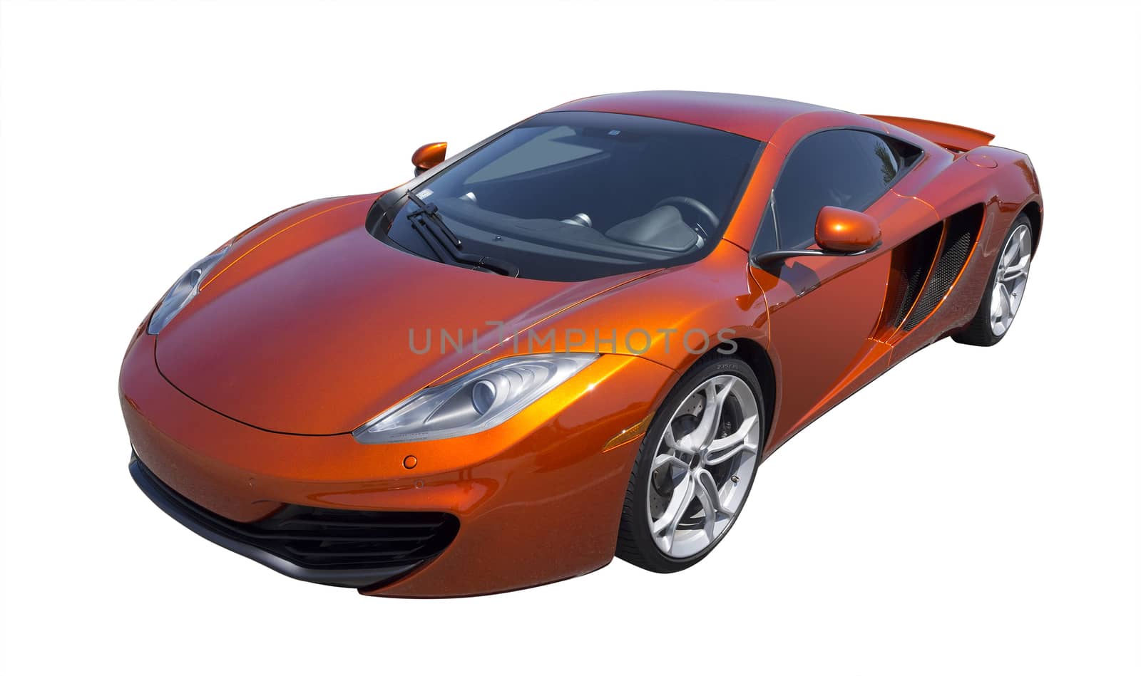 Fast British sports car in metallic orange, isolated with clipping path
