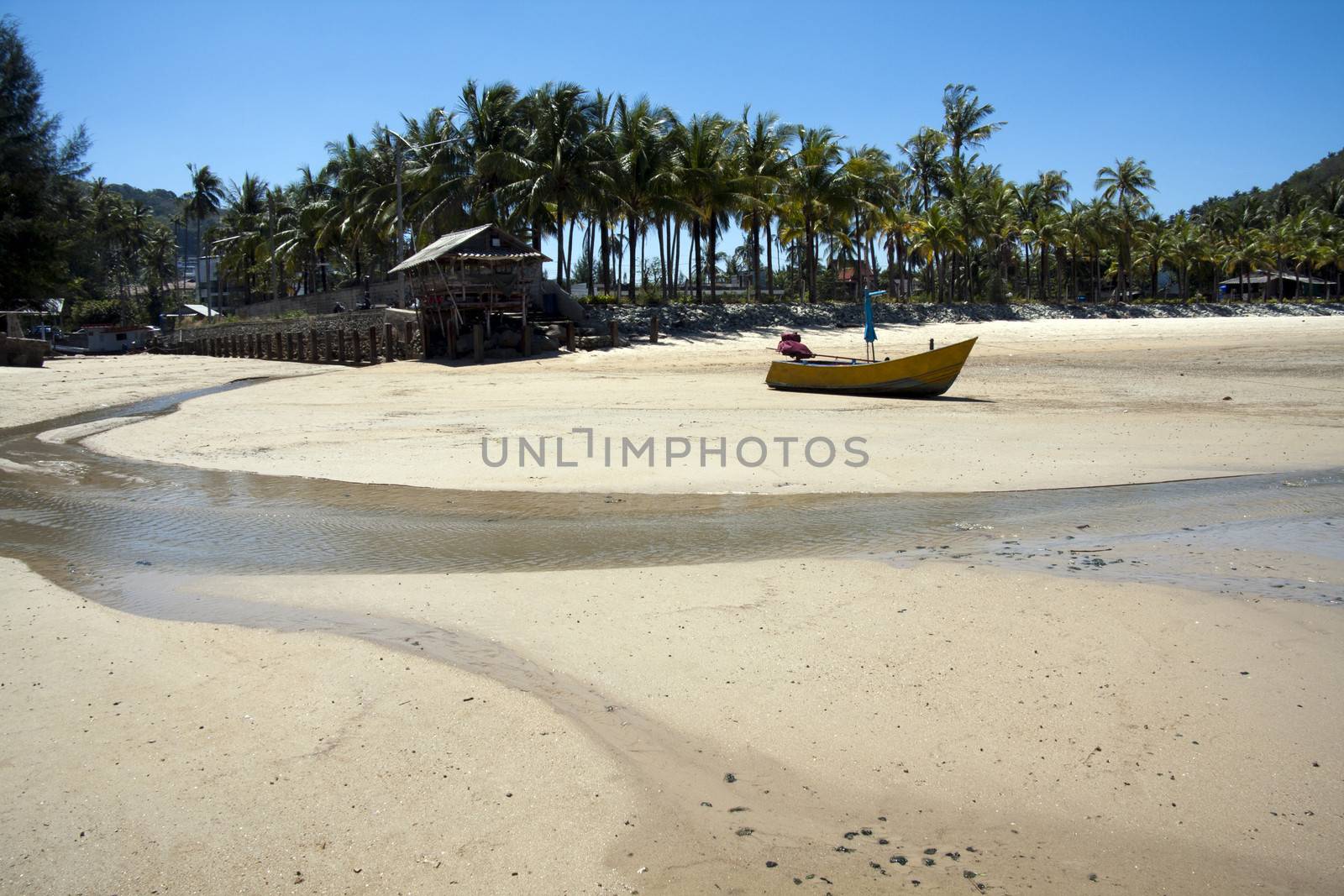 Boat on beach at low tide, Bang Tao, Phuket, Thailand