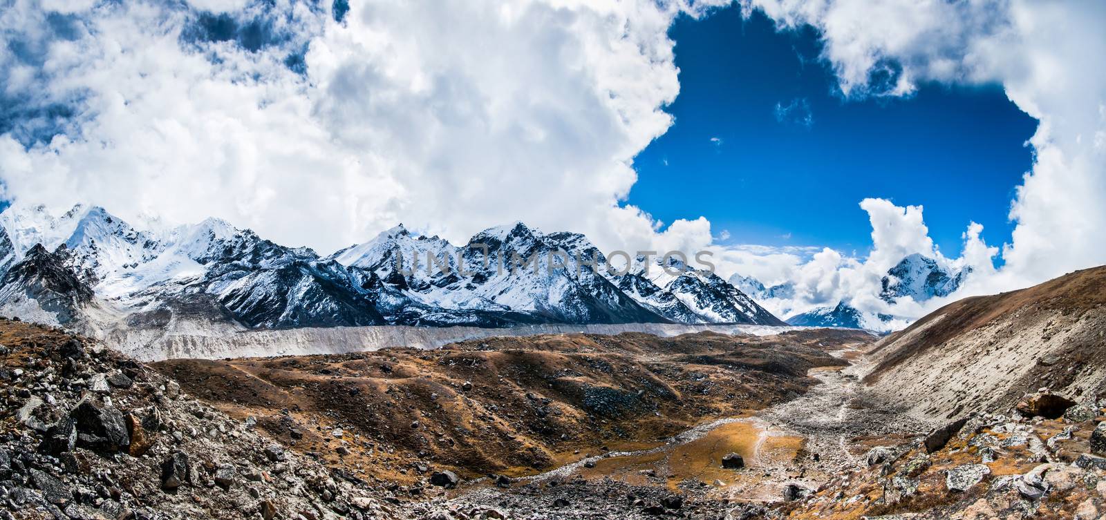 Panoramic view on the mountain peaks and glacier near Everest ba by Arsgera