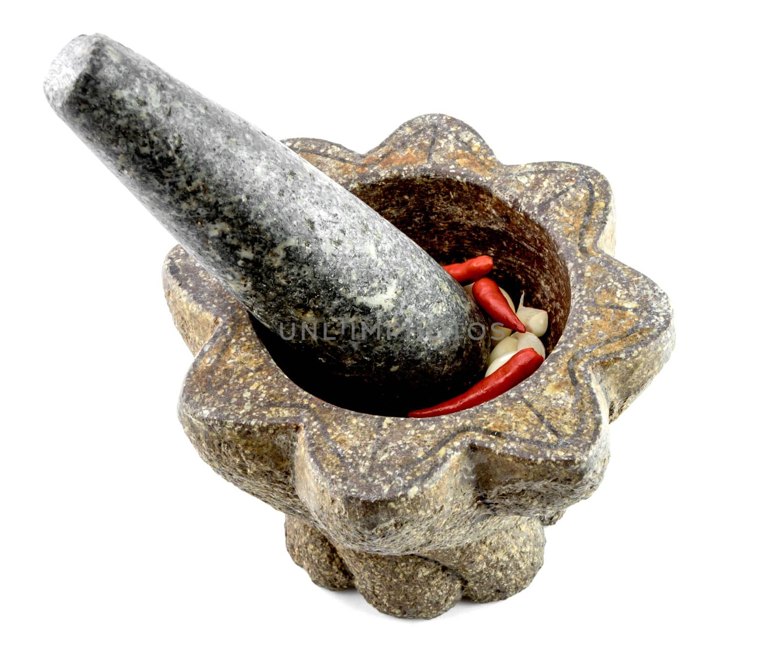 Stone Mortar with garlic and chili pepper isolate on white backg by bunwit