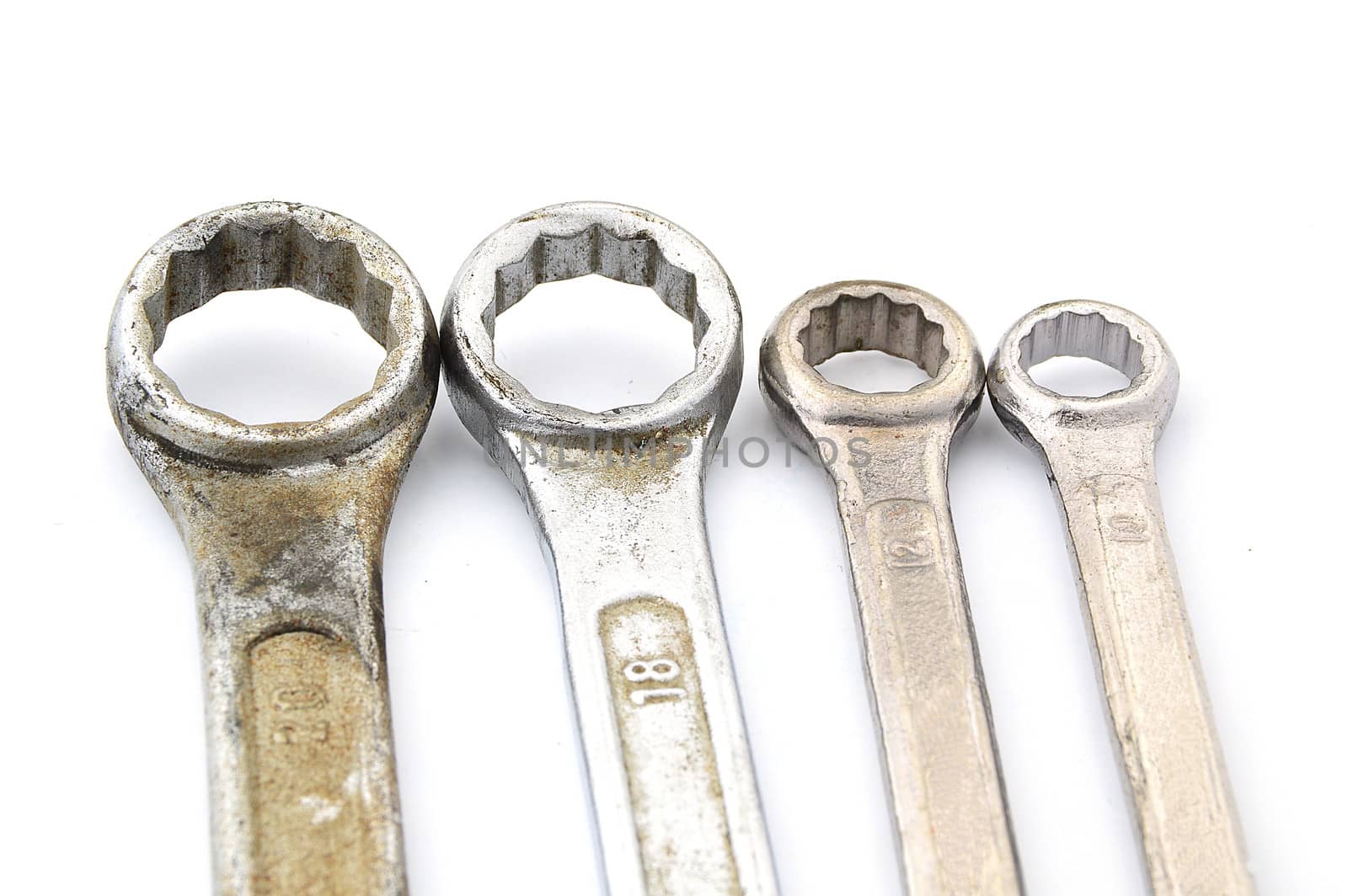 four old box wrenches isolate on white background