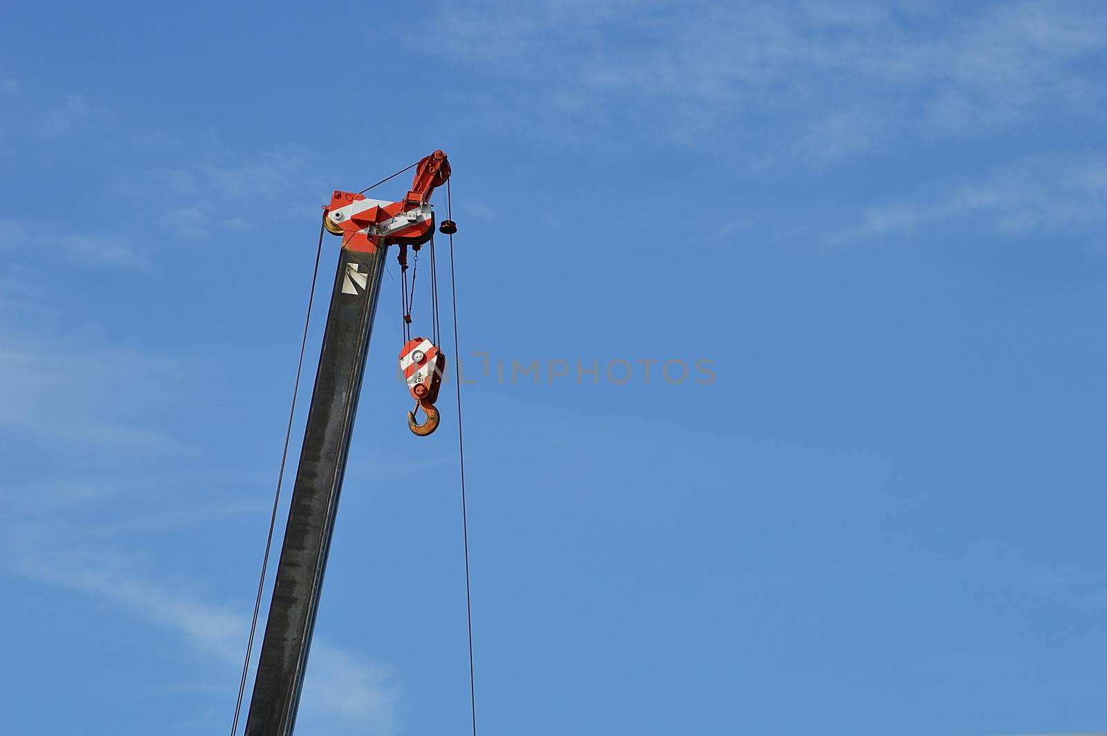 crane with blue sky by Lekchangply