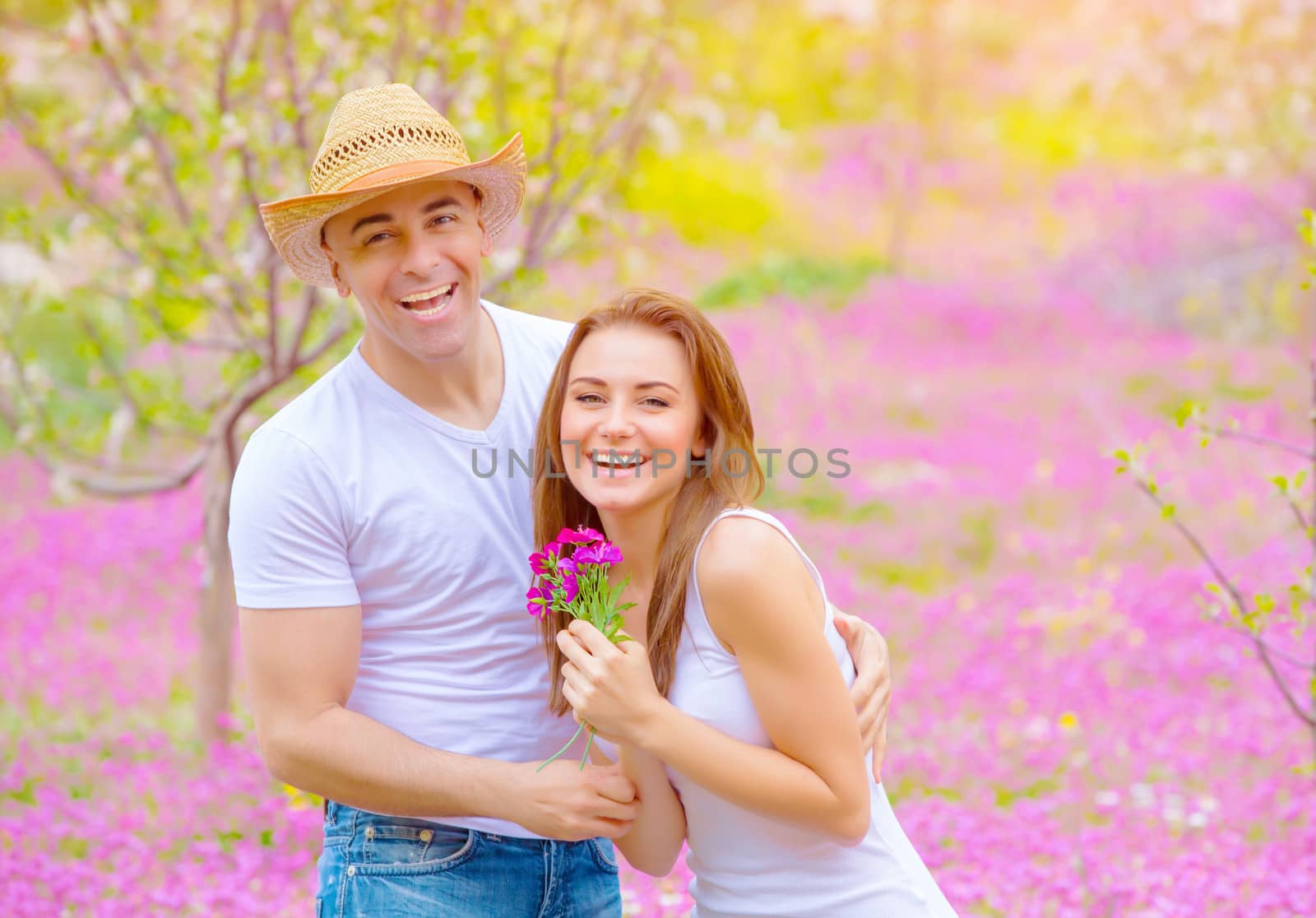 Happy couple in summer park by Anna_Omelchenko