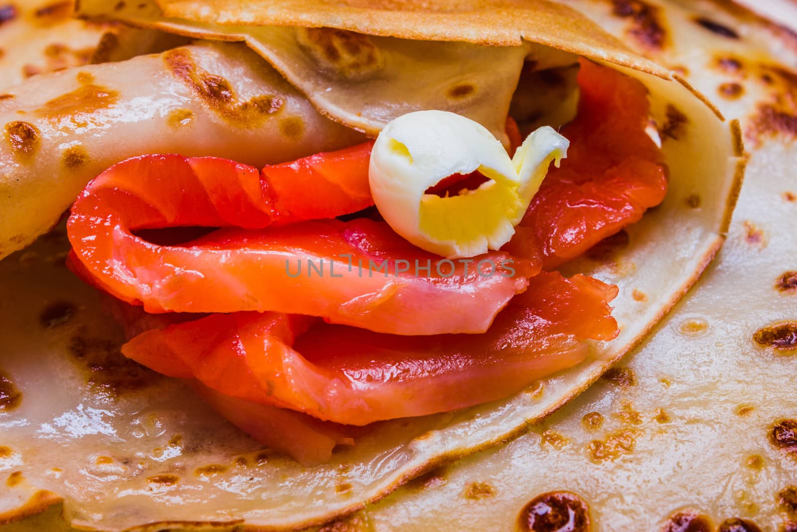 pancakes with smoked salmon and butter on the Shrovetide