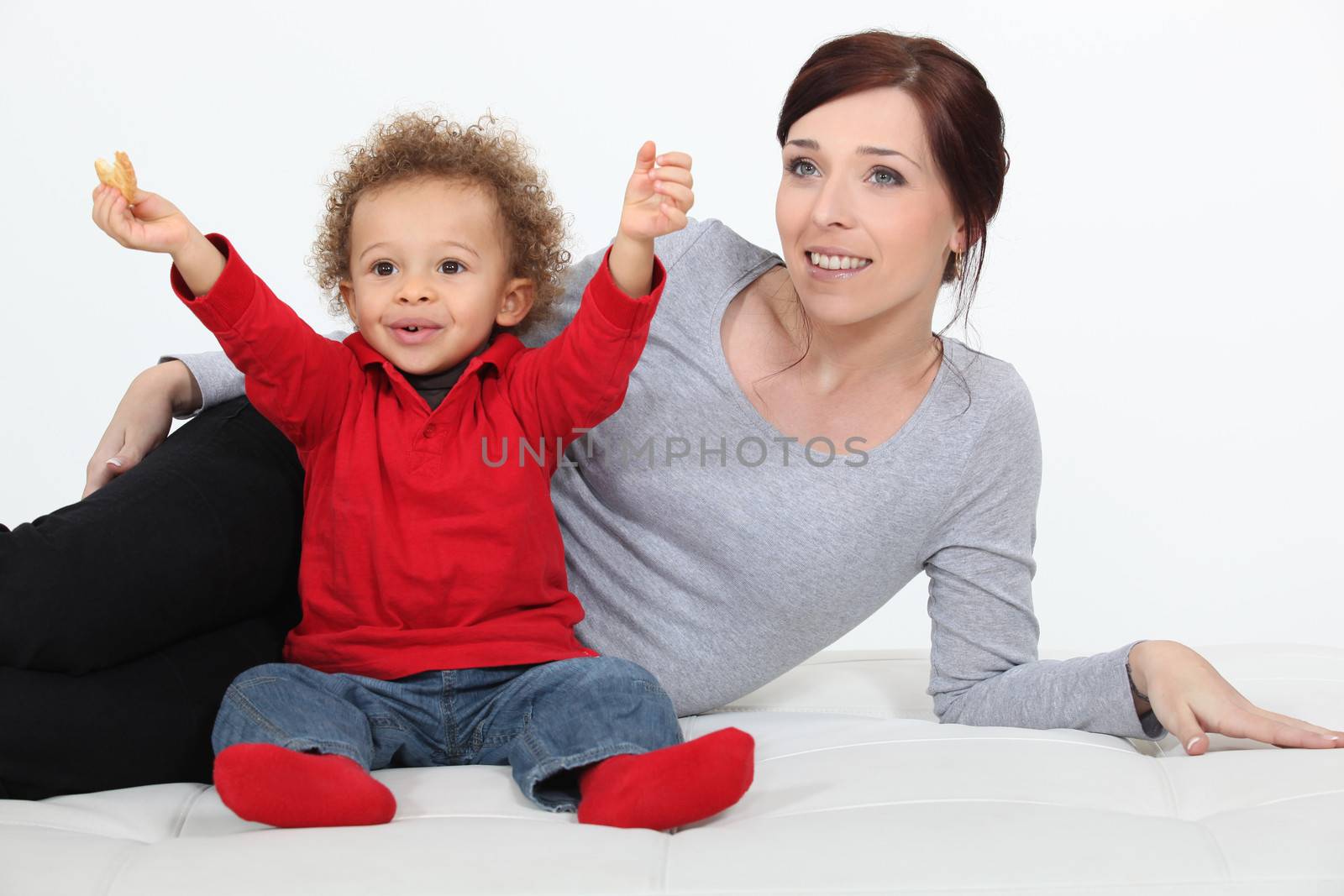 Woman playing with her son by phovoir