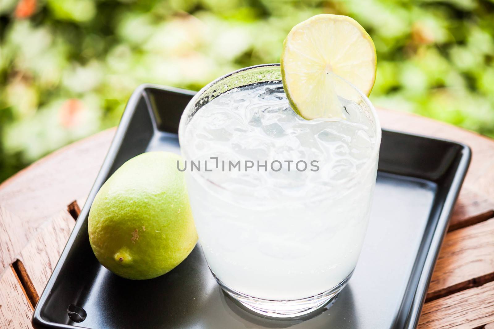 Fresh glass of lime juice with lime by punsayaporn