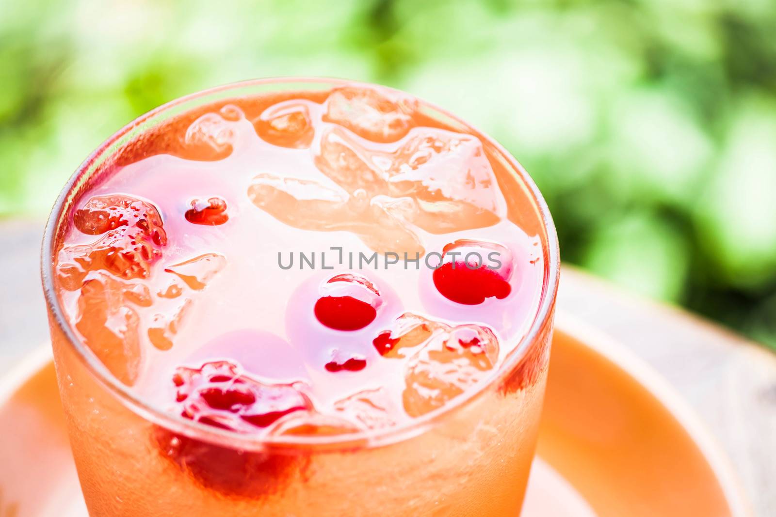 Red cherry on cold mix fruits juice soda  by punsayaporn