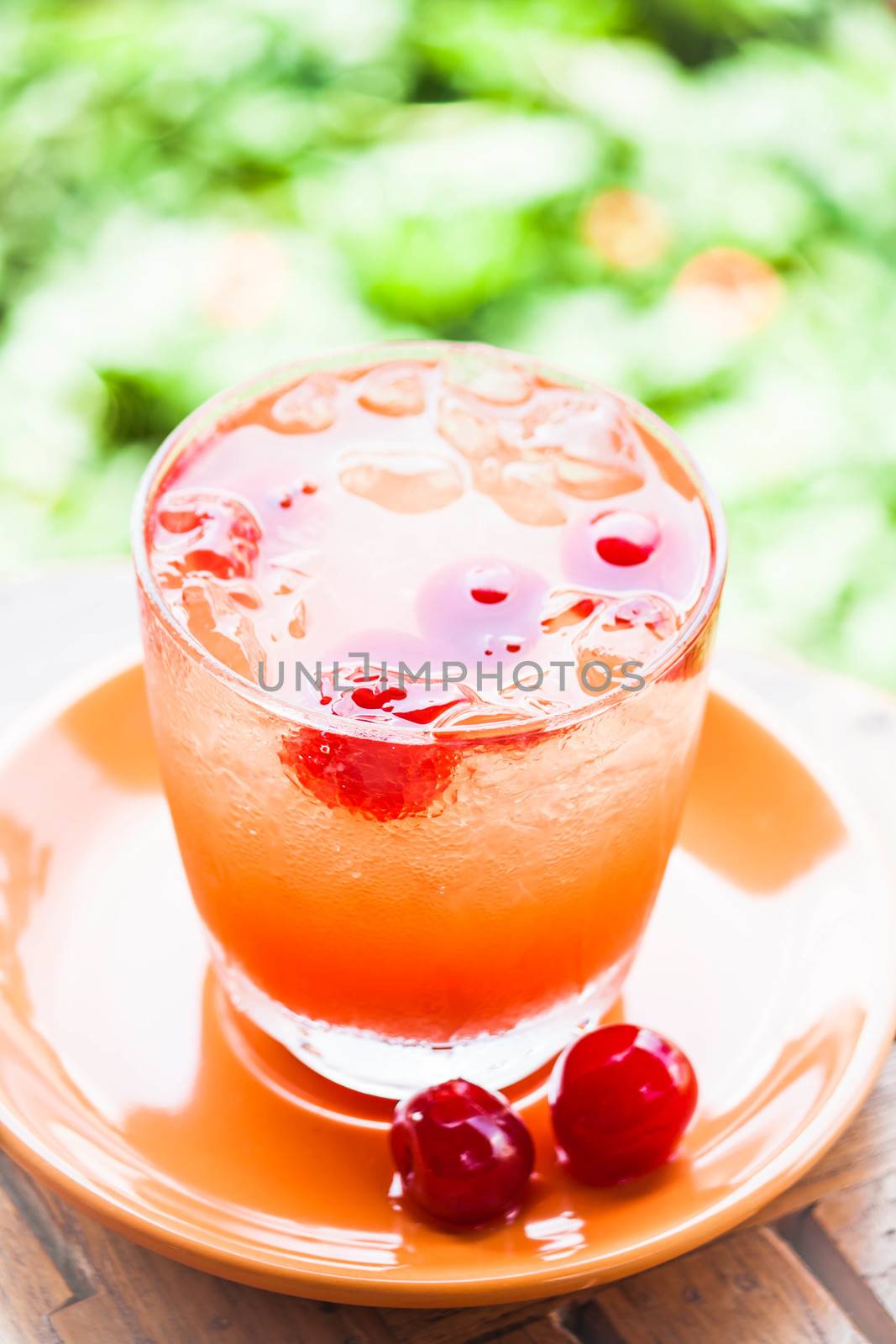 Fresh glass of cold mix fruits juice soda