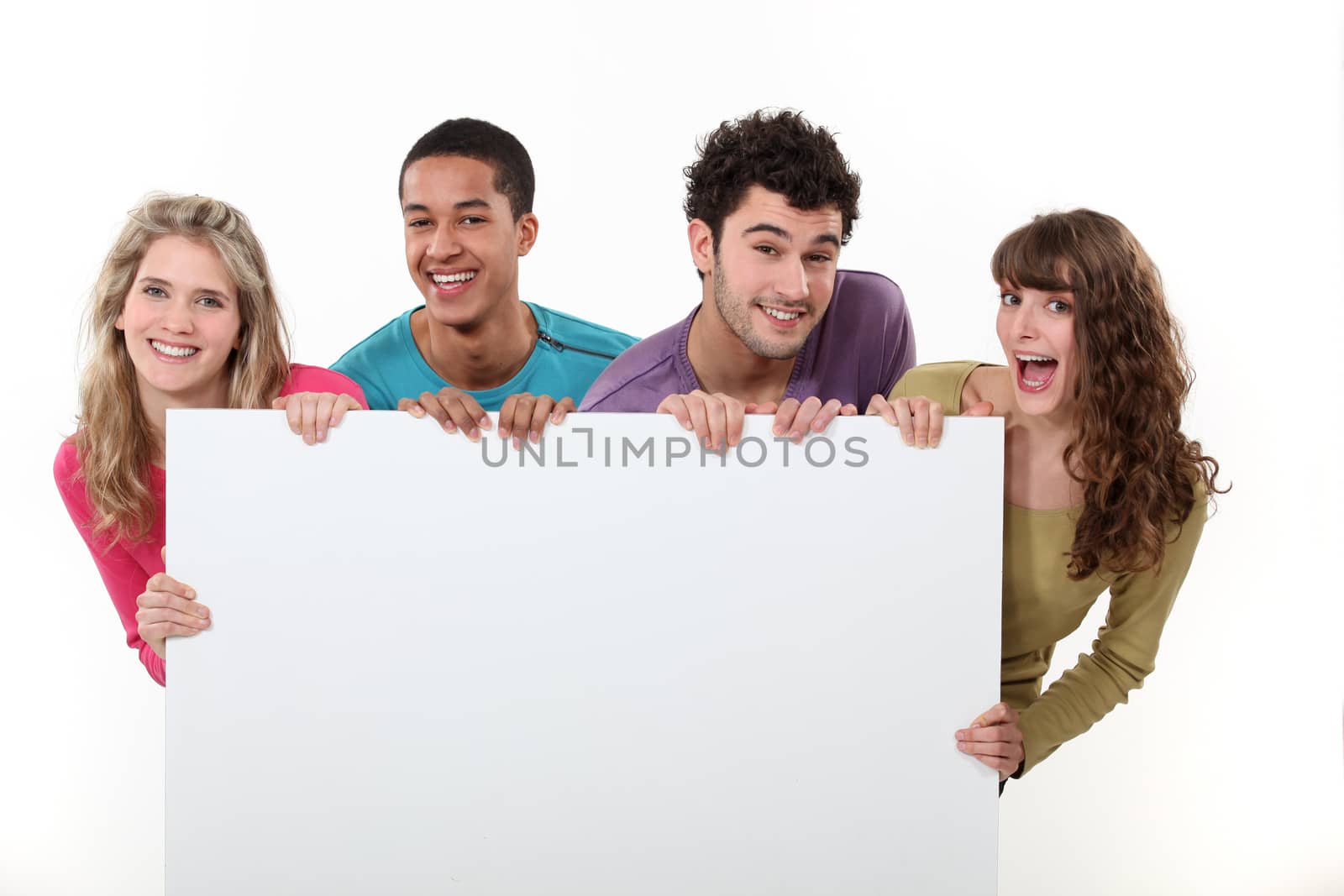 group of friends holding a blank poster by phovoir
