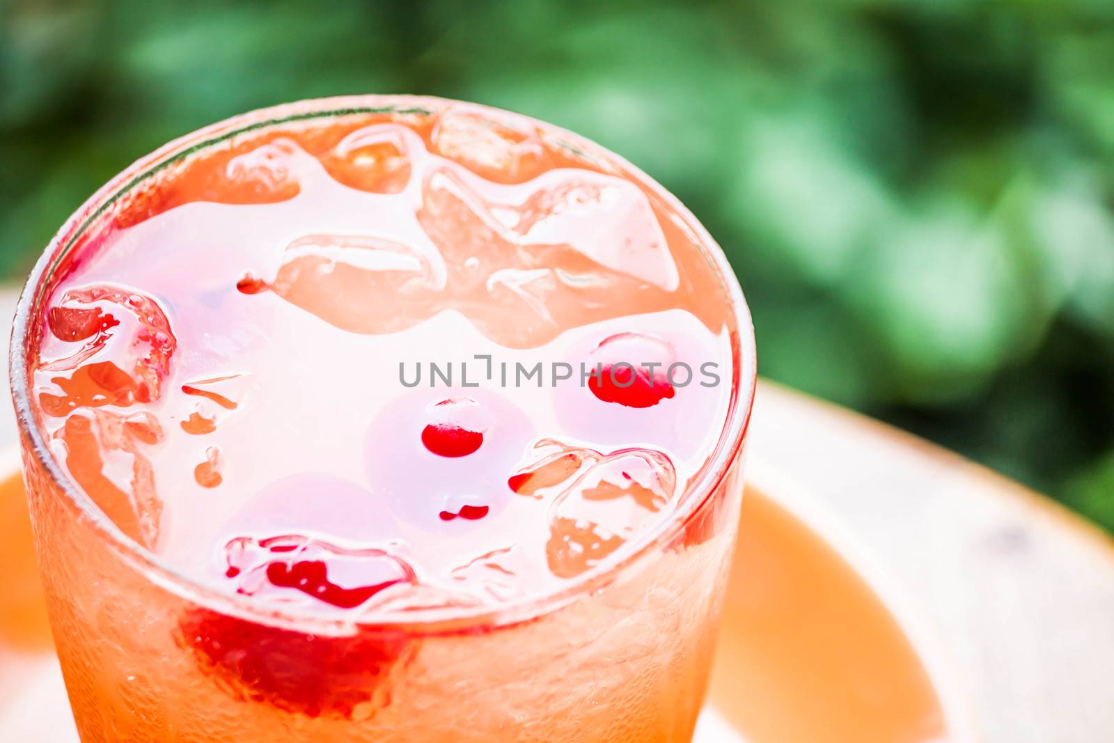 Glass of iced mix fruits juice soda  by punsayaporn