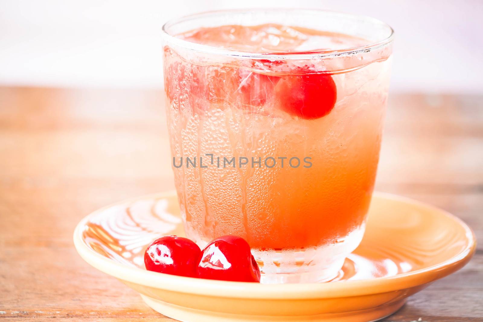 Light mix fruits juice soda drink on table by punsayaporn