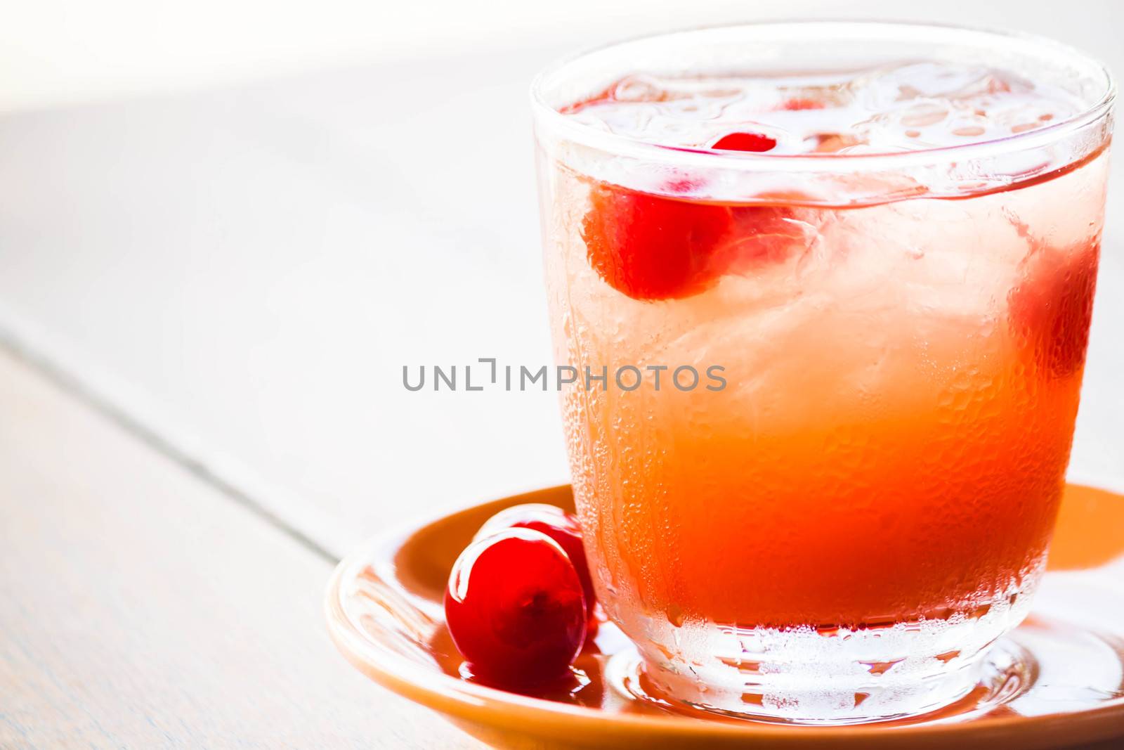 Red cherry decorate iced mix fruits juice soda by punsayaporn