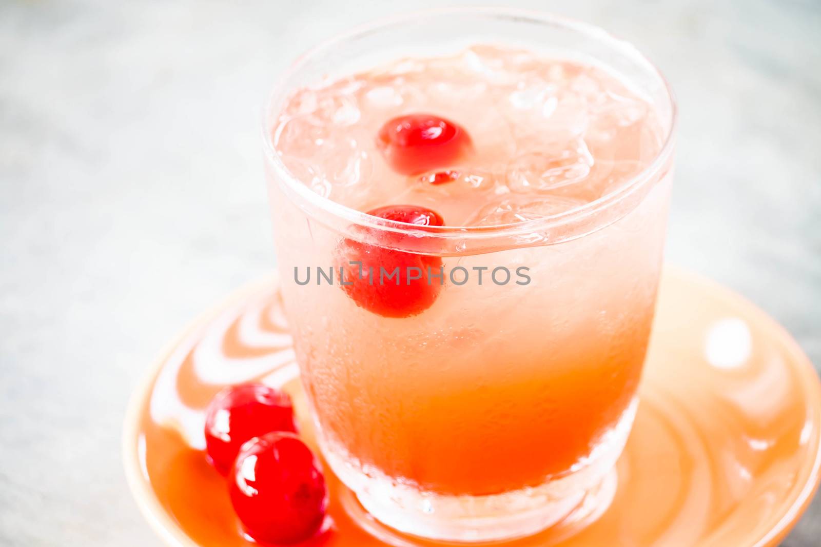 Glass of mix fruits juice soda with cherry by punsayaporn