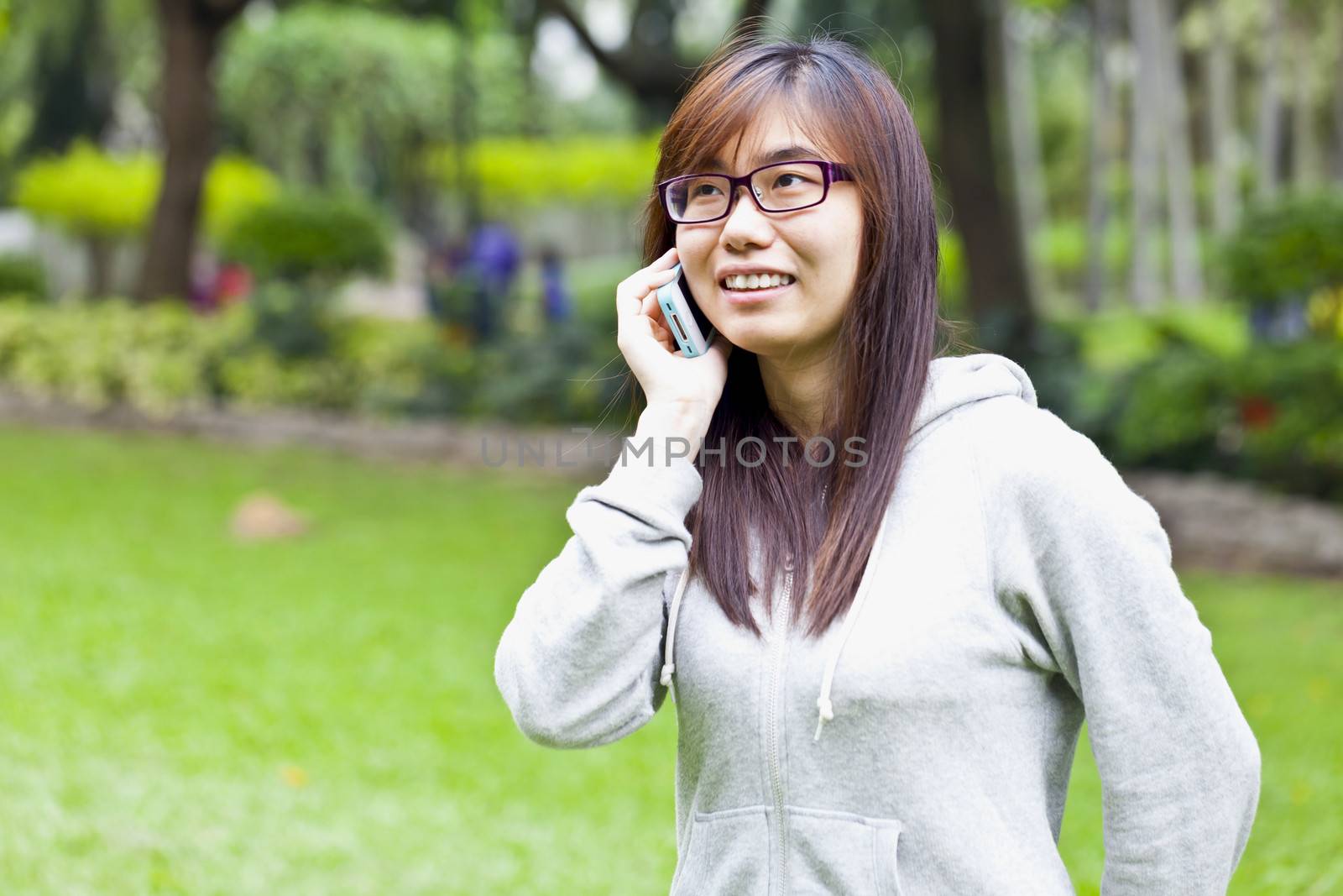 Young business woman with mobile phone in leisure time
