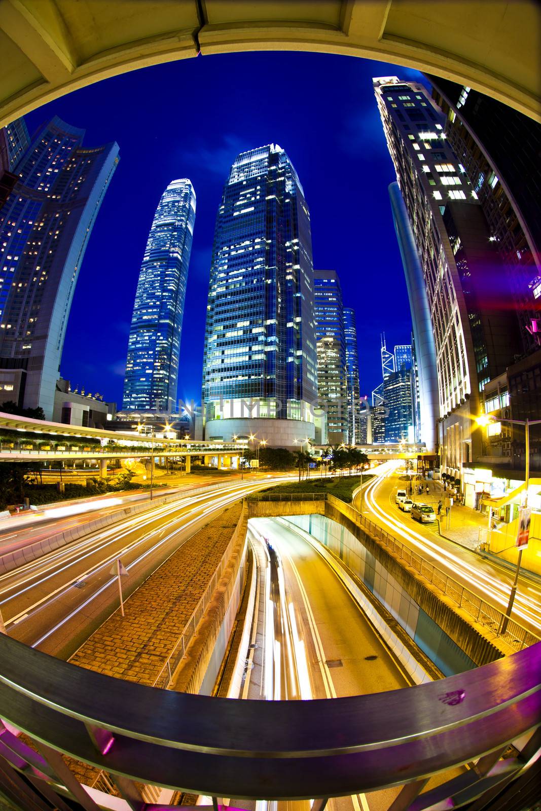 Traffic lights through city at night