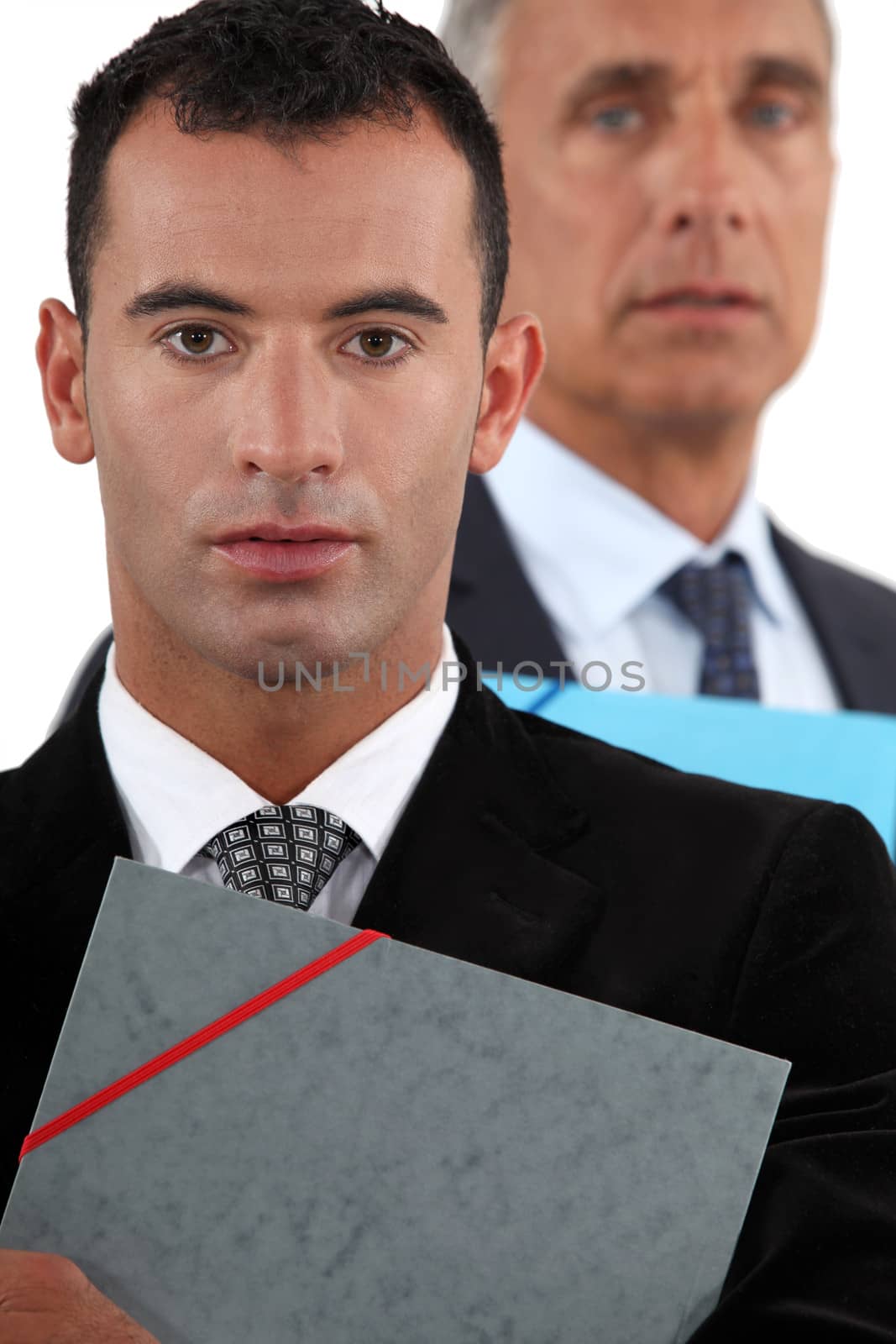 Businessmen holding documents