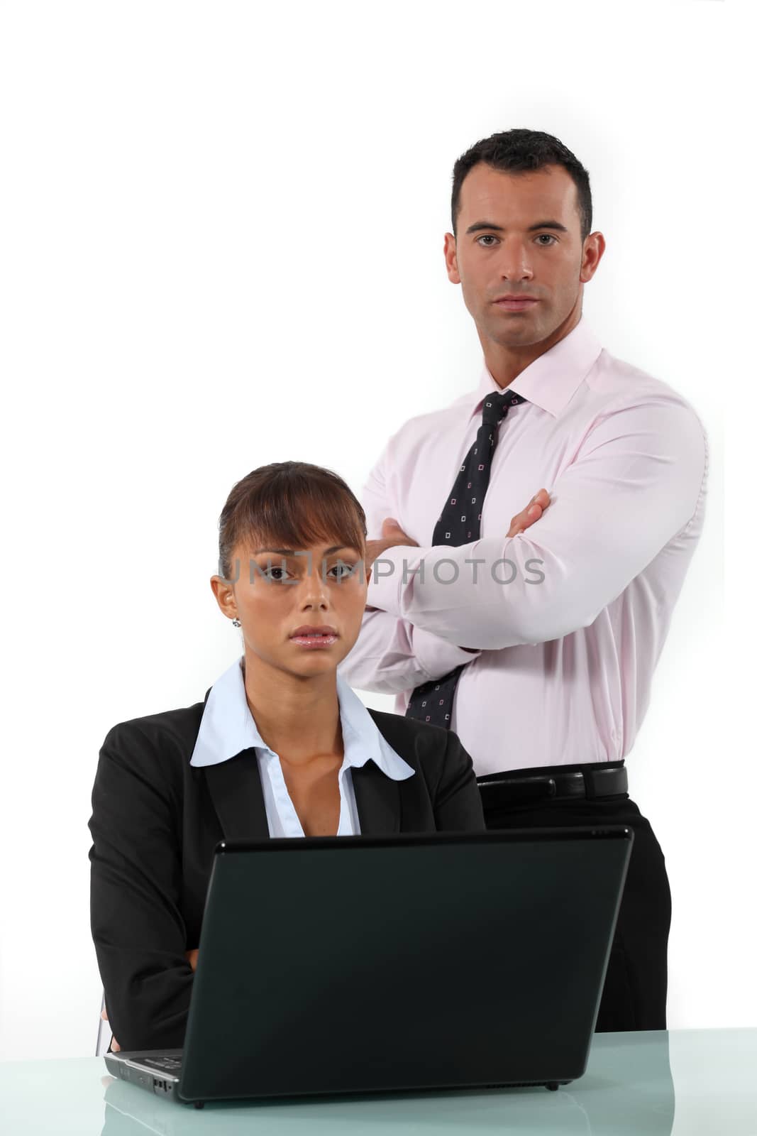young businessman and businesswoman posing
