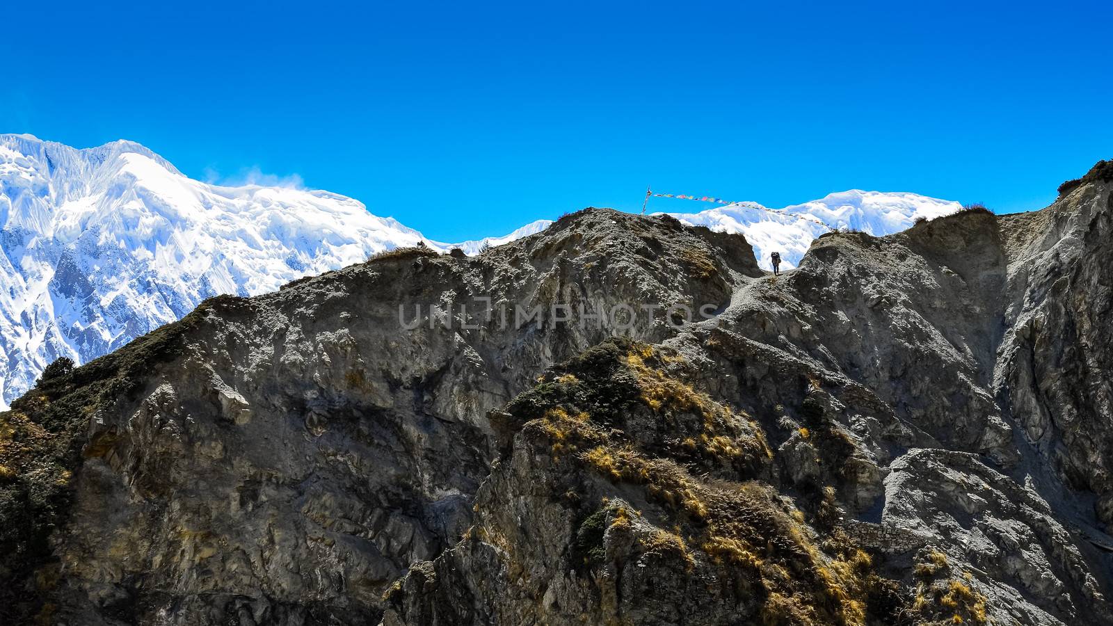 Silhouette of mountain trekker in Himalayas rocky mountains