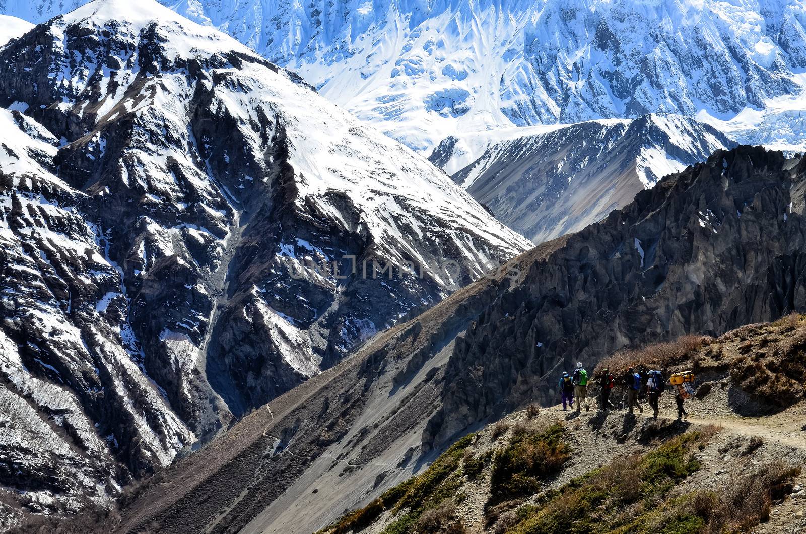 Group of mountain trekkers backpacking in Himalayas mountains, Nepal